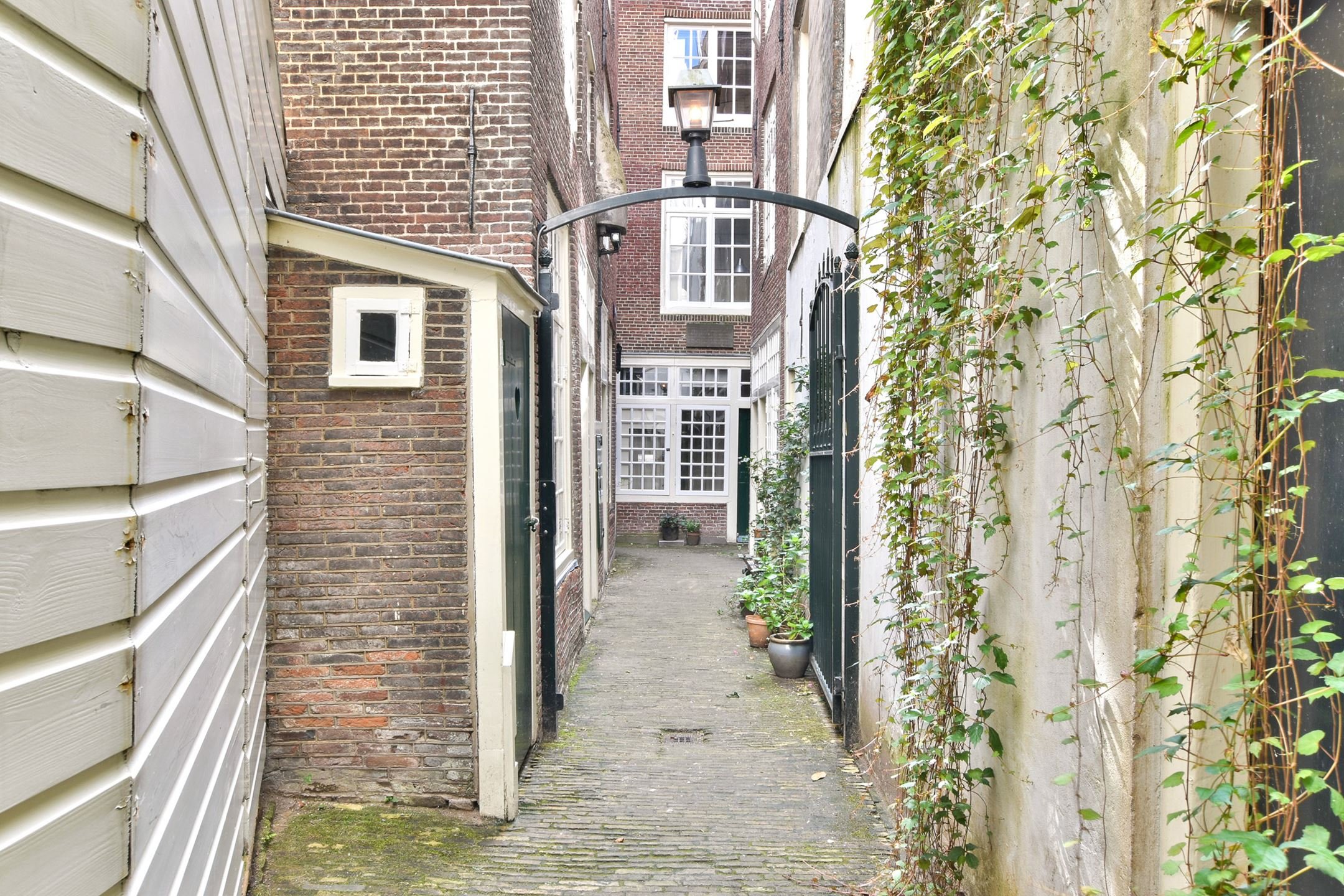  The gate with latern atop, beside the original loo. 