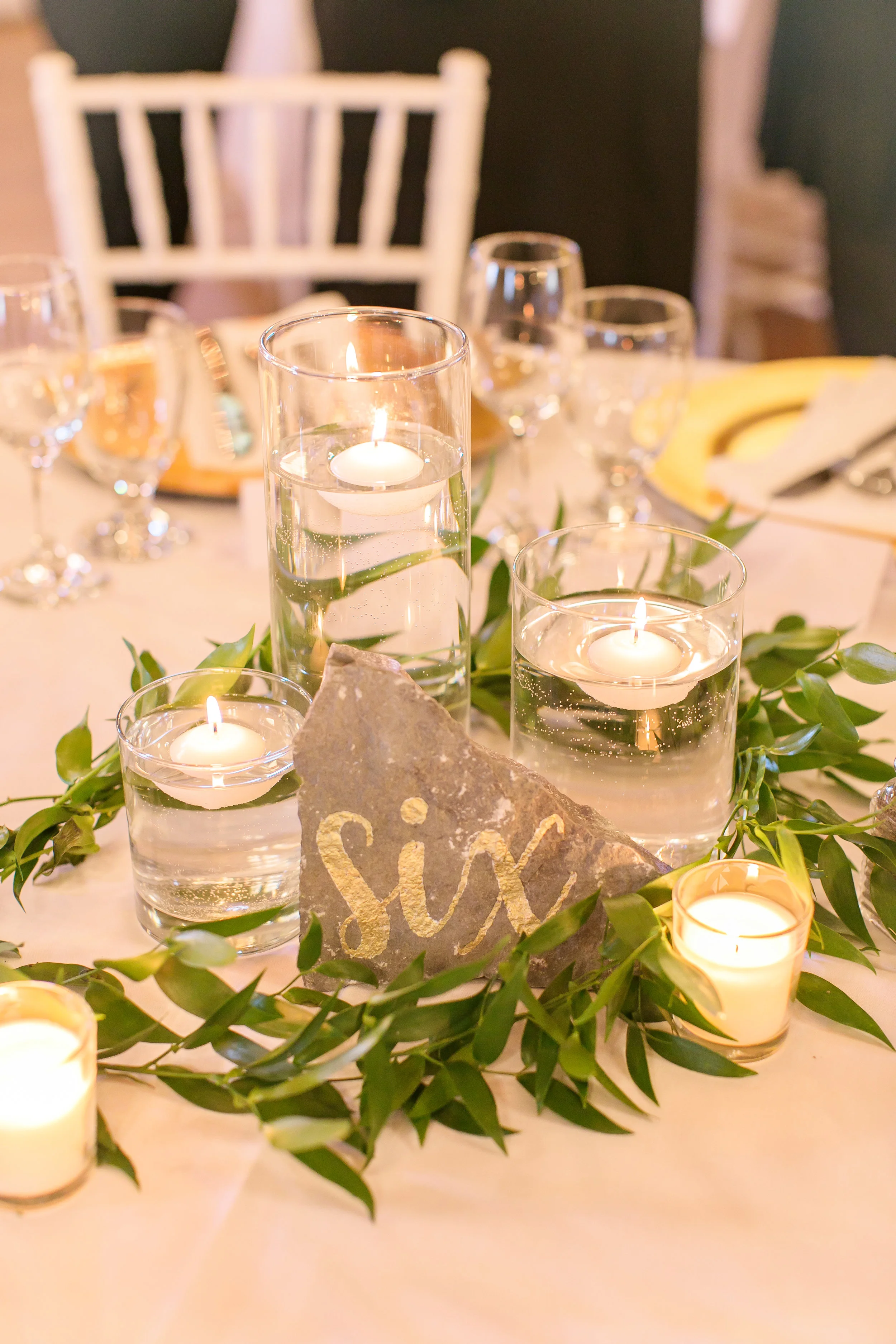 Varying height cylinder vases - for use with only floating candles, not pillar candles Photo by Brady McCloskey Photography