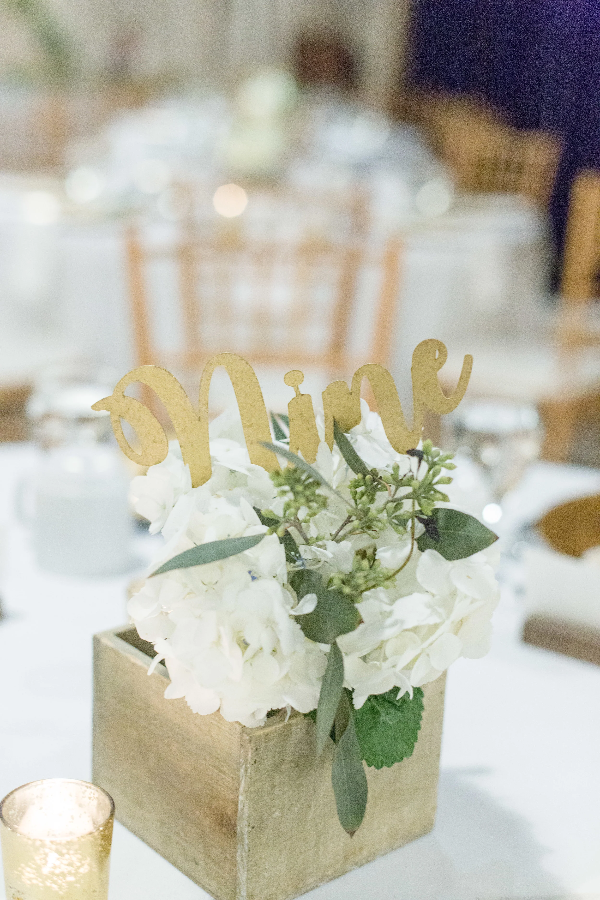 Assorted wooden flower boxes Gold script table numbers Photo by Nicole Anne Photography