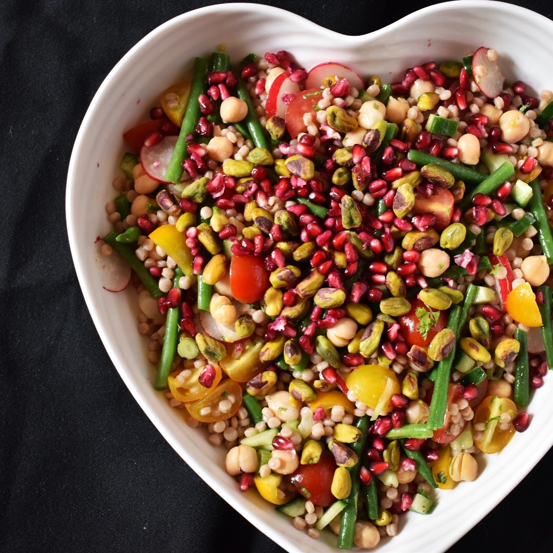 Vegan pomegranate and pistachio giant cous cous salad recipe
