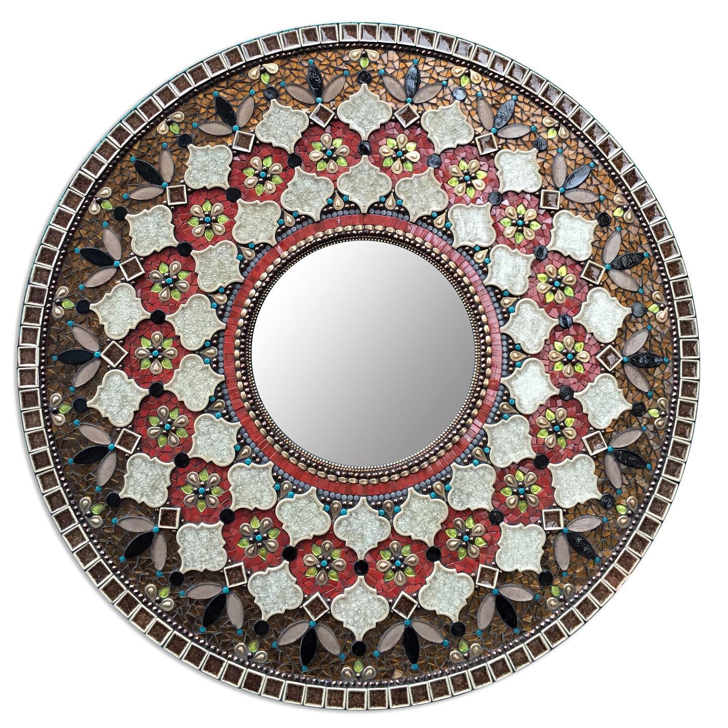 This a custom mirror I created a few years ago. The couple that commissioned this piece wanted to pull colors and inspiration from art they collected in their travel together.

36in diameter w/ 12in mirror glass. 
.
.
.

#mosaicart&nbsp;#mosaic #zeta