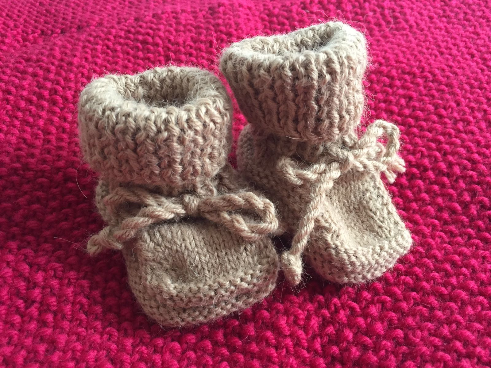 Olivia was wrapped in this blanket after birth and the "shoes" where supposed to be worn when she came back home after birth. Both items were made for her by her great grandmother on her Papa's side. 