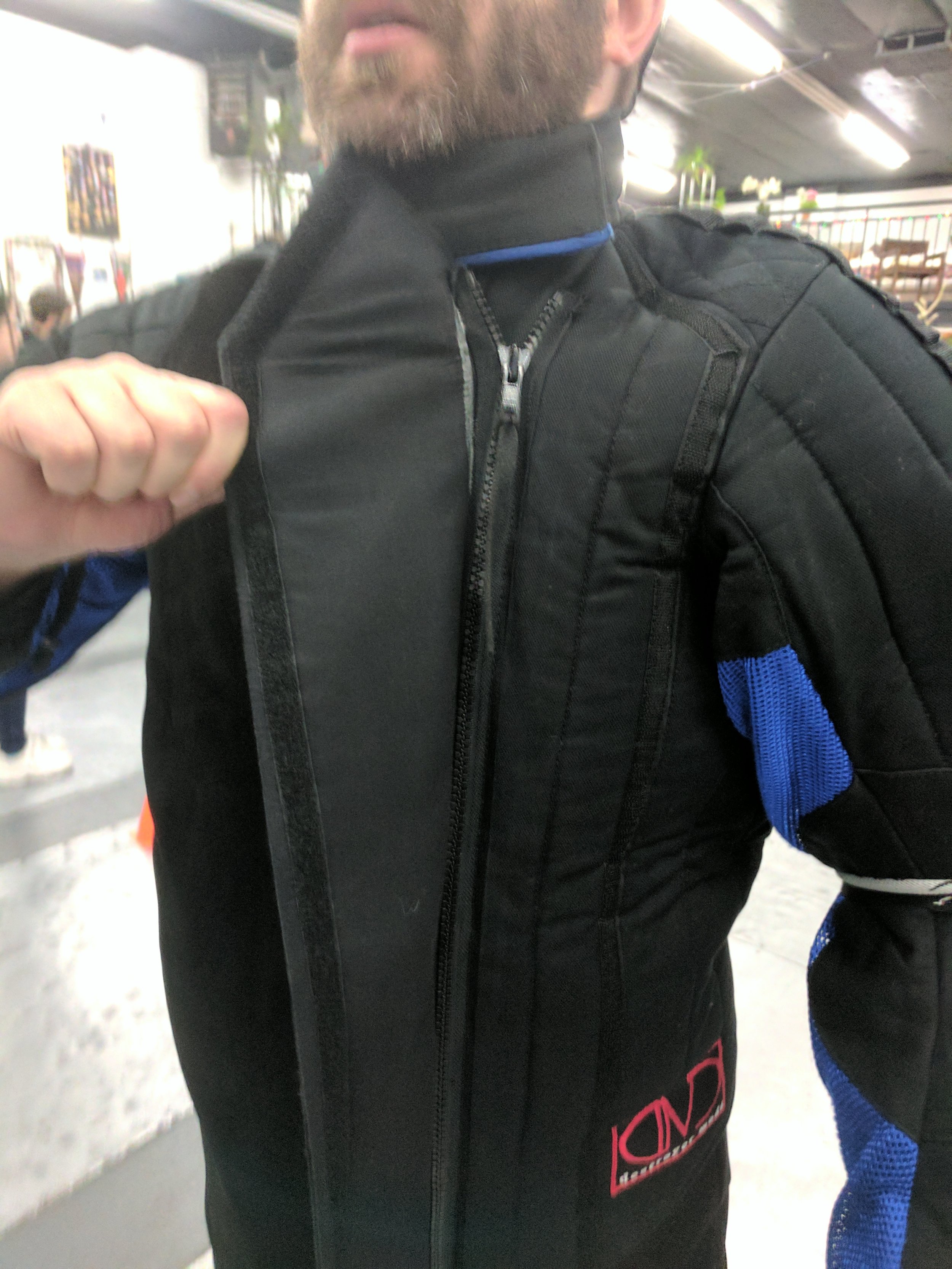 The thing velcro is replaced by a 1 inch thicker strip in the production model.
