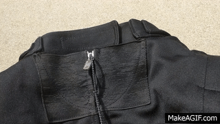 I am barely pulling on this zipper, and you can see how easily it comes undone.