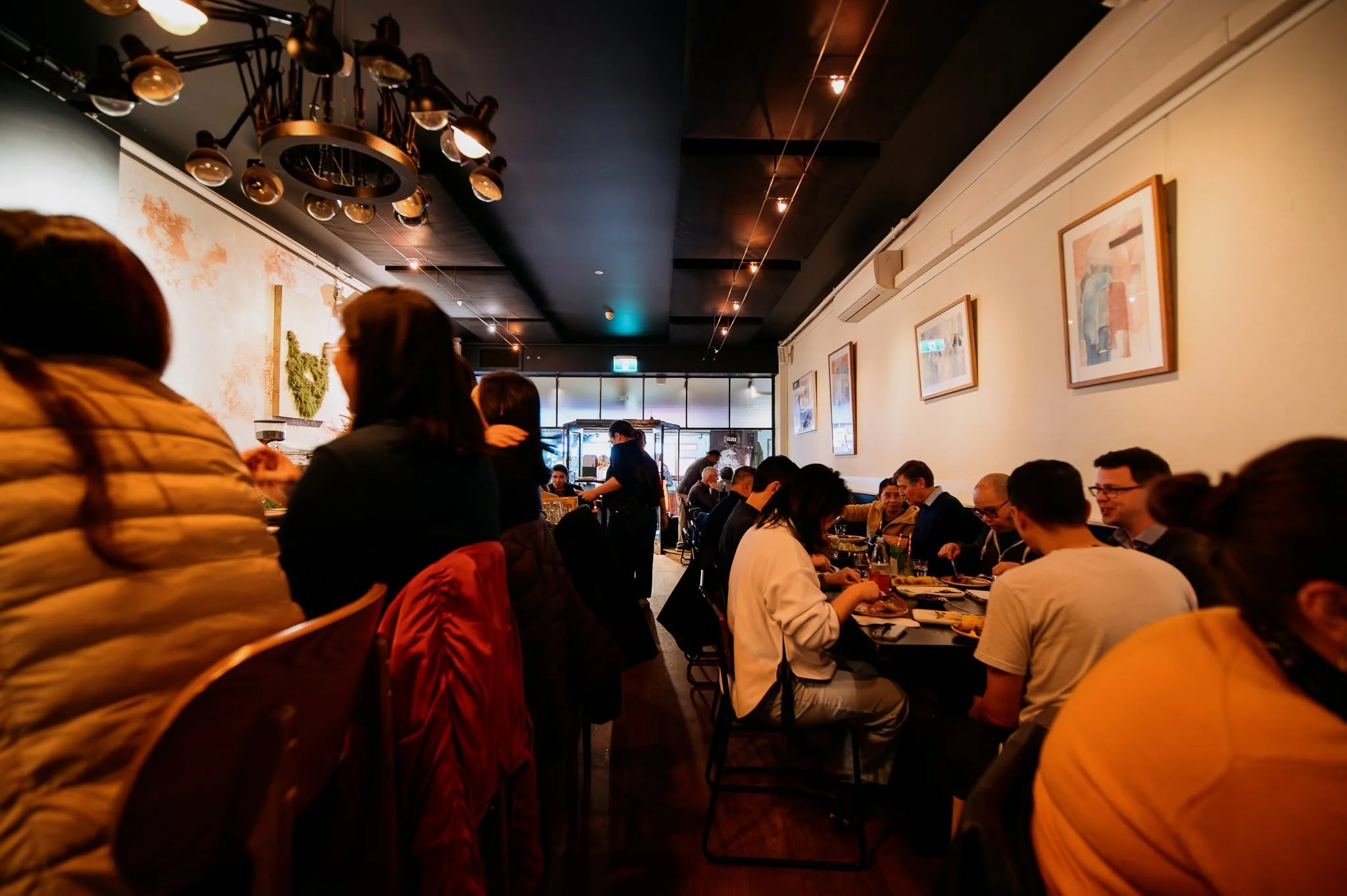 Bivouac Canteen & Bar interior in Northbridge, Perth, featuring a stylish bar, warm lighting, and guests enjoying a relaxed dining experience.