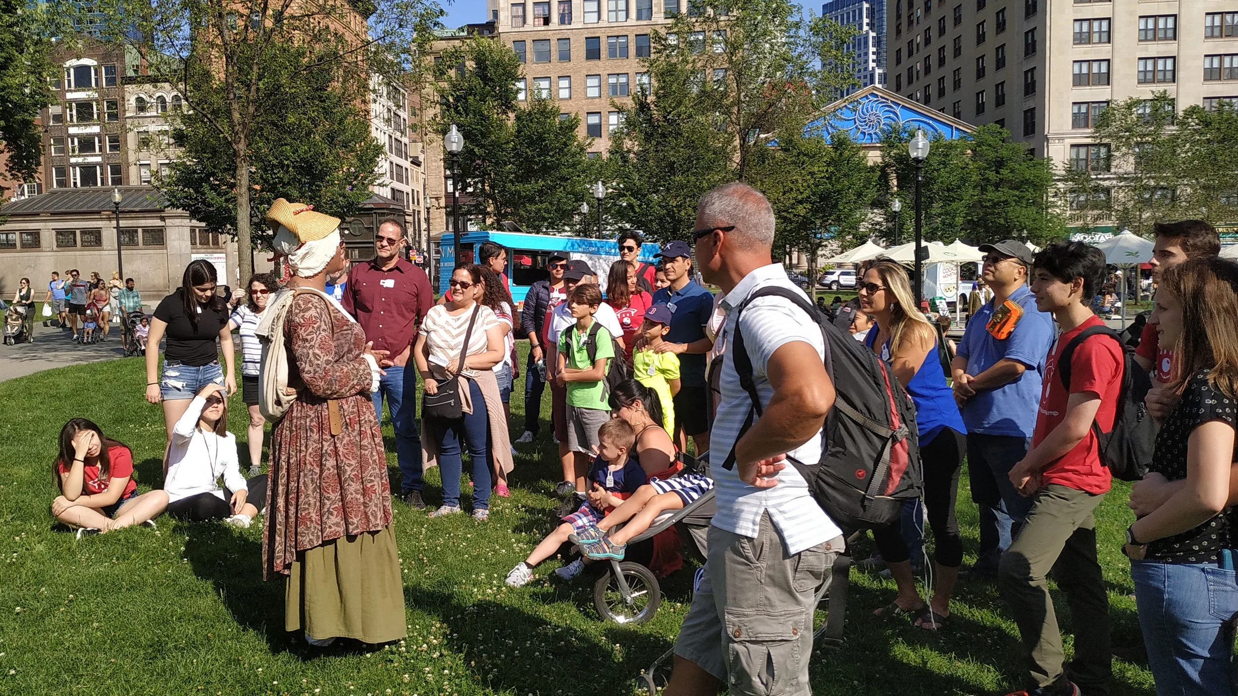 The Innovators gather around the leader of the Freedom Trail tour, dressed as Phyllis Wheatley, a prominent African-American poet