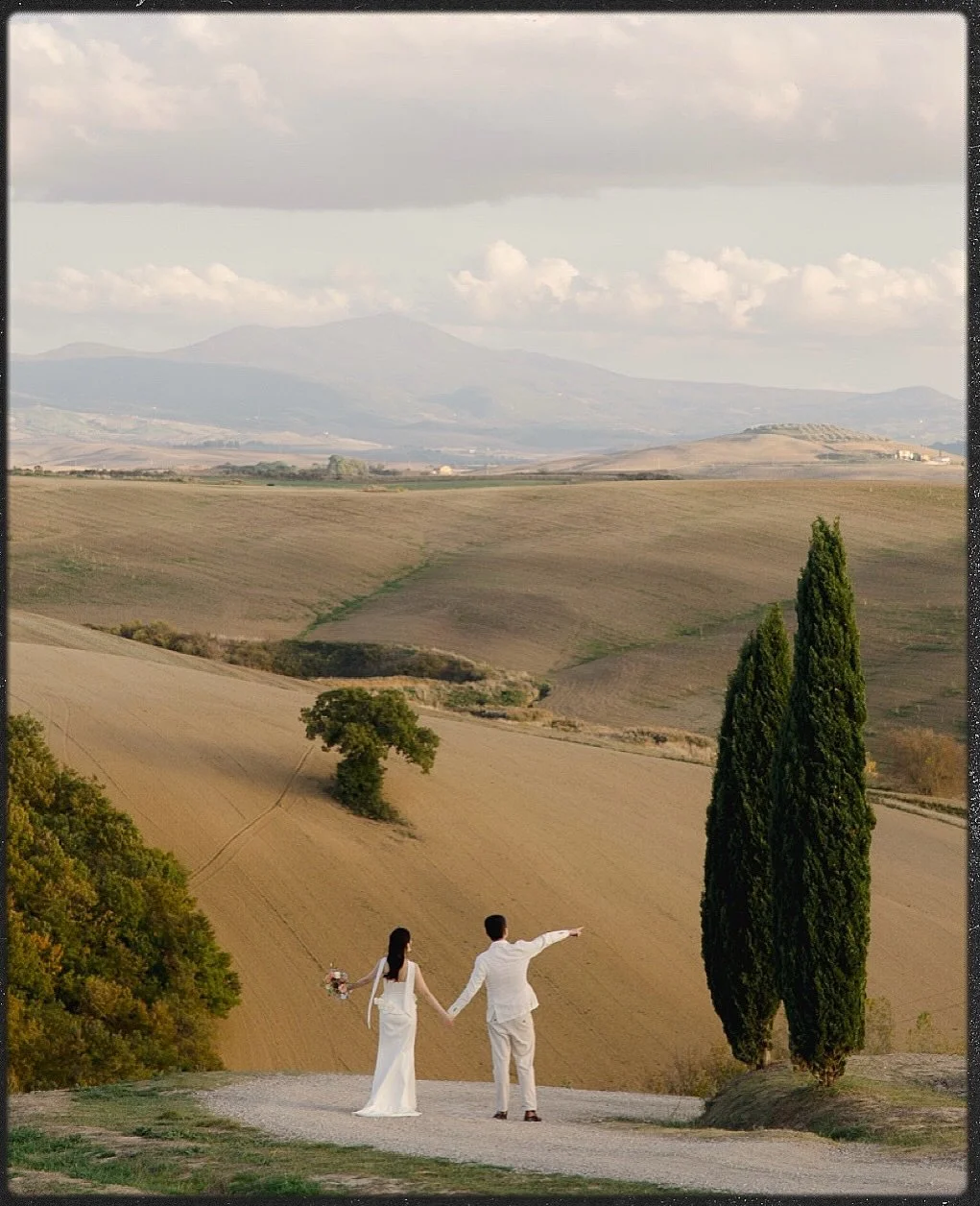 Elegant. Timeless. Cinematic. 
Like a still frame from a classic Italian film shot somewhere in the Tuscan countryside 🇮🇹

Soft light, a vintage cabrio, endless cypress roads and effortless style.

#tuscanywedding #tuscanyphotographer #italywedding