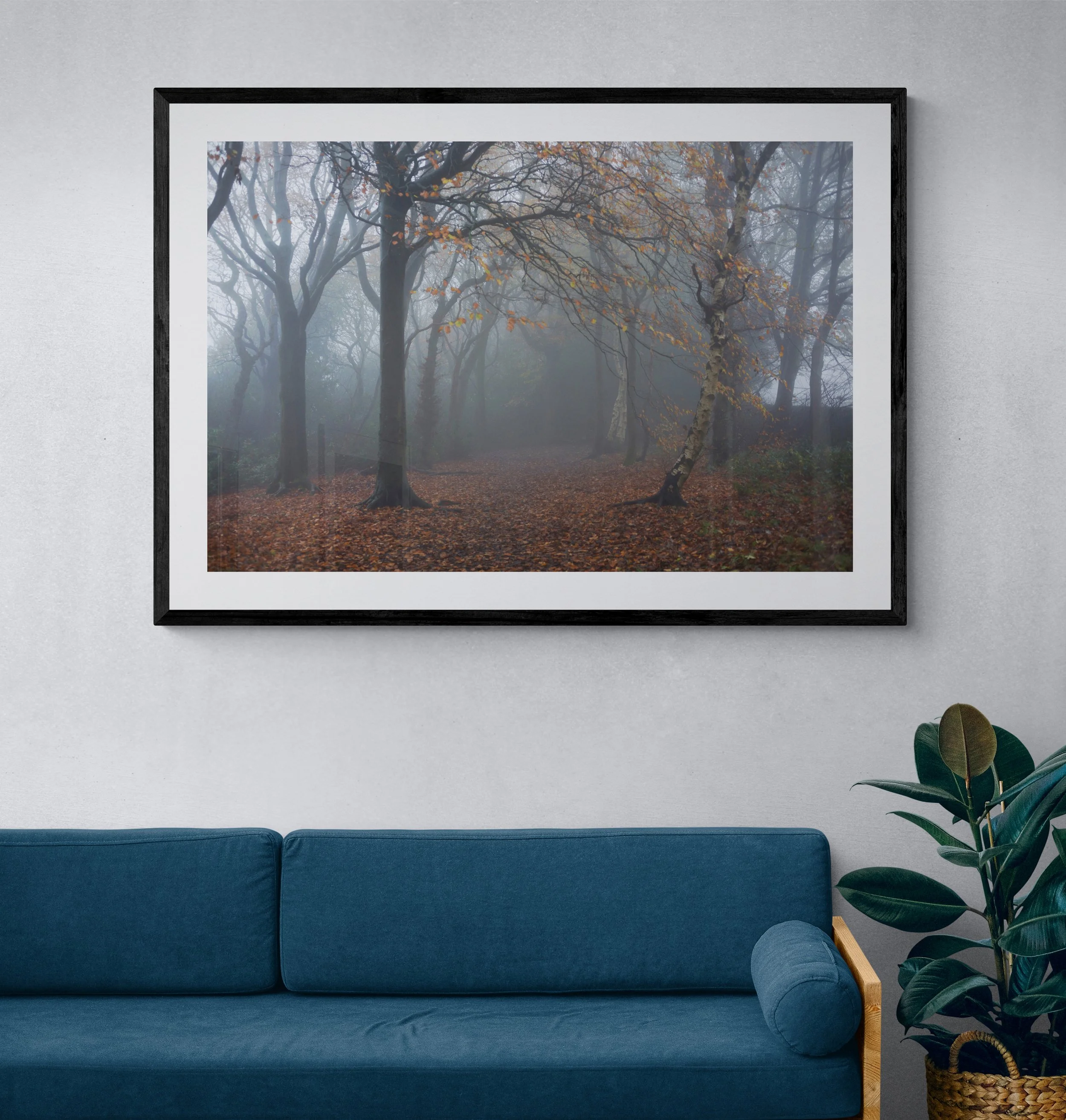 Living_room_with_wood_frame_sofa_and_plant.jpg