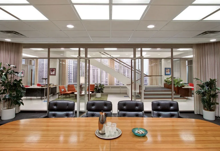 The conference room featuring Eames Time Life office chairs. 