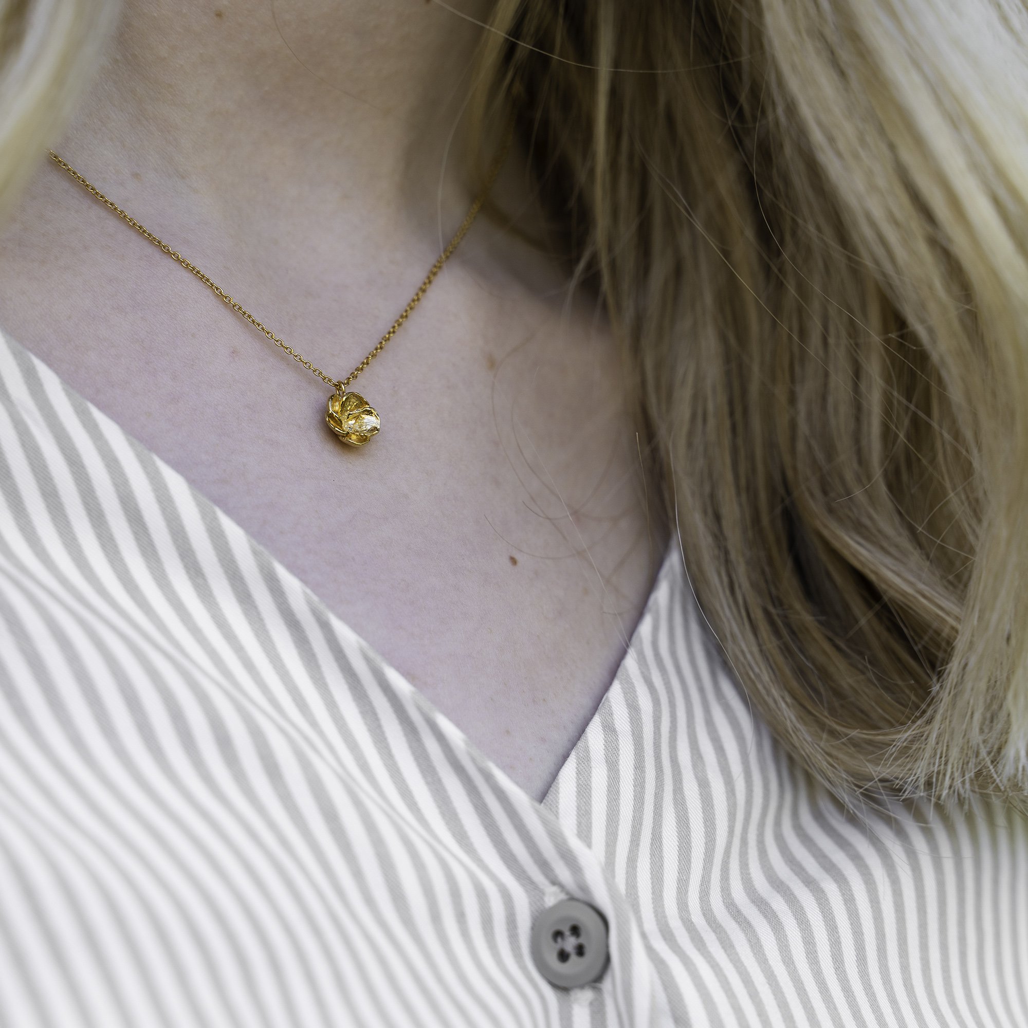 gold blossom necklace worn.jpg