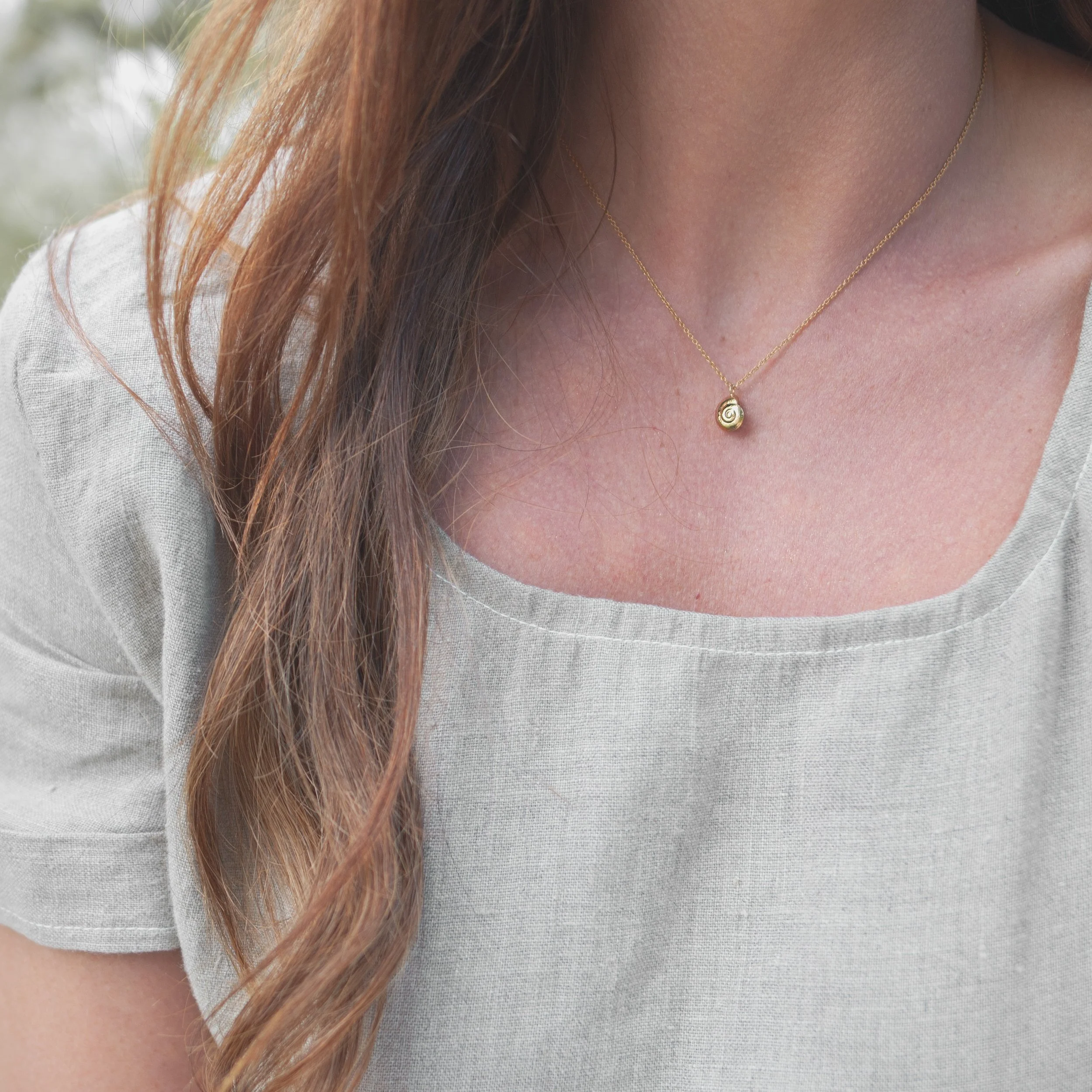 Repurposed gold periwinkle shell sustainable necklace