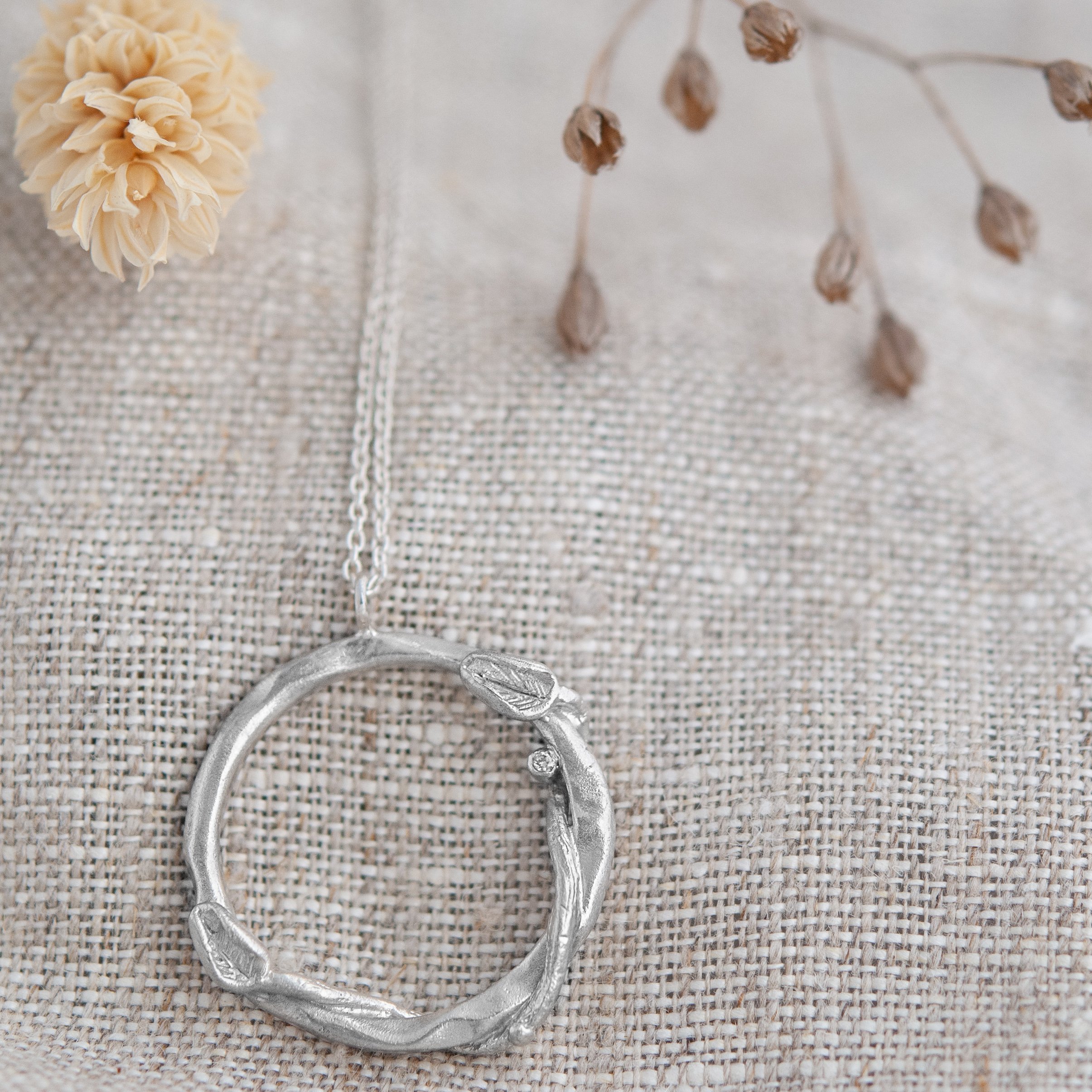 Recycled diamond leaf infinity sterling silver necklace