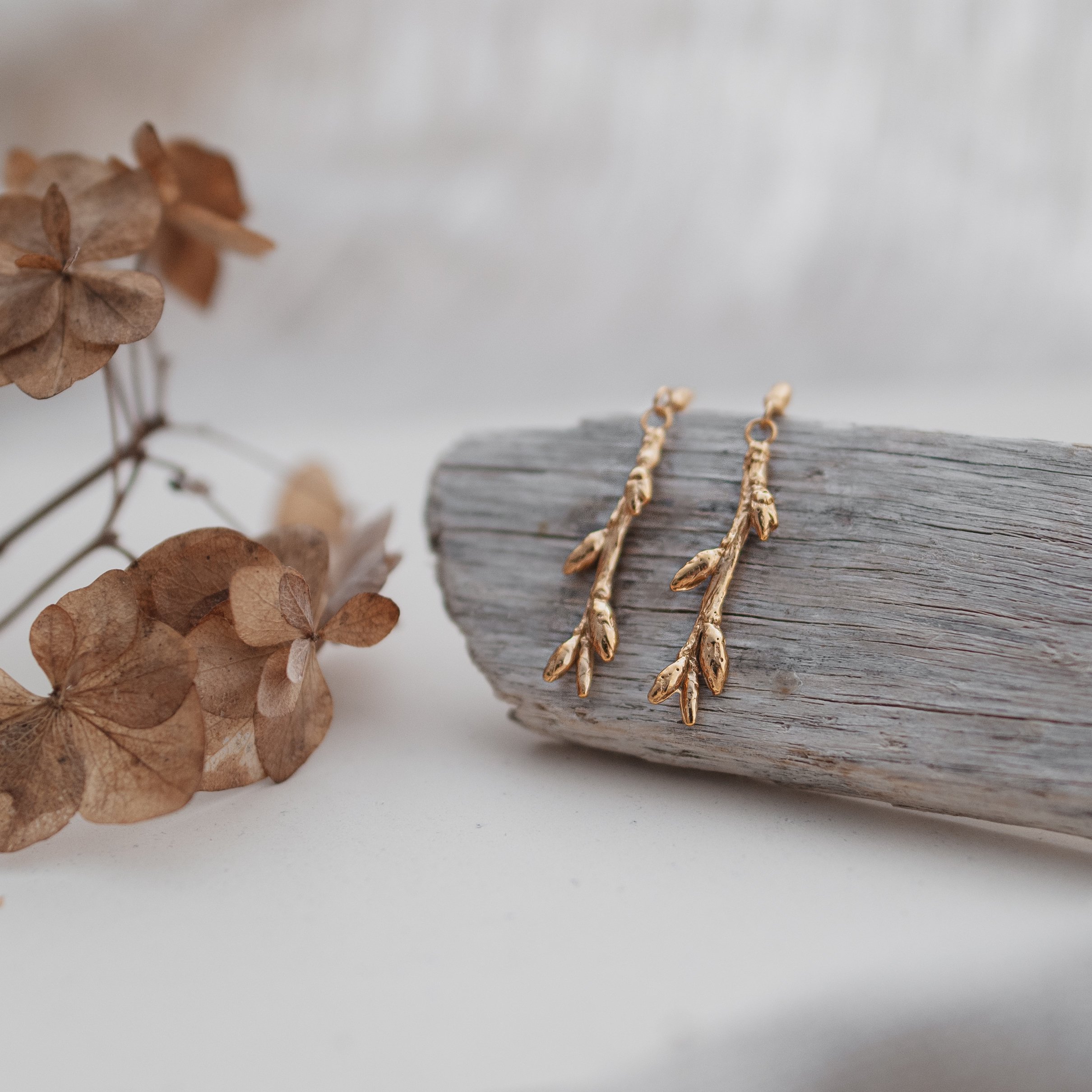 Birch twig drop earrings in gold sqaure.JPG