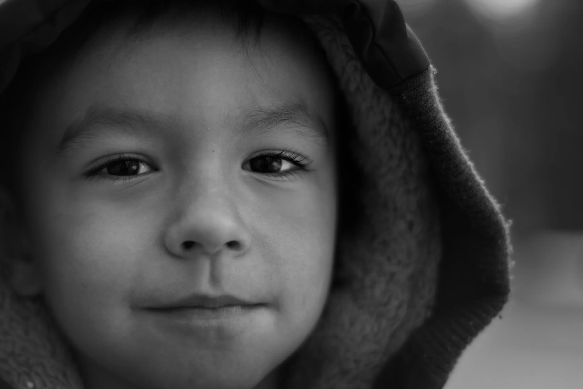 A black and white Photo of a young boy taken at Centennial Park in Thunder Bay