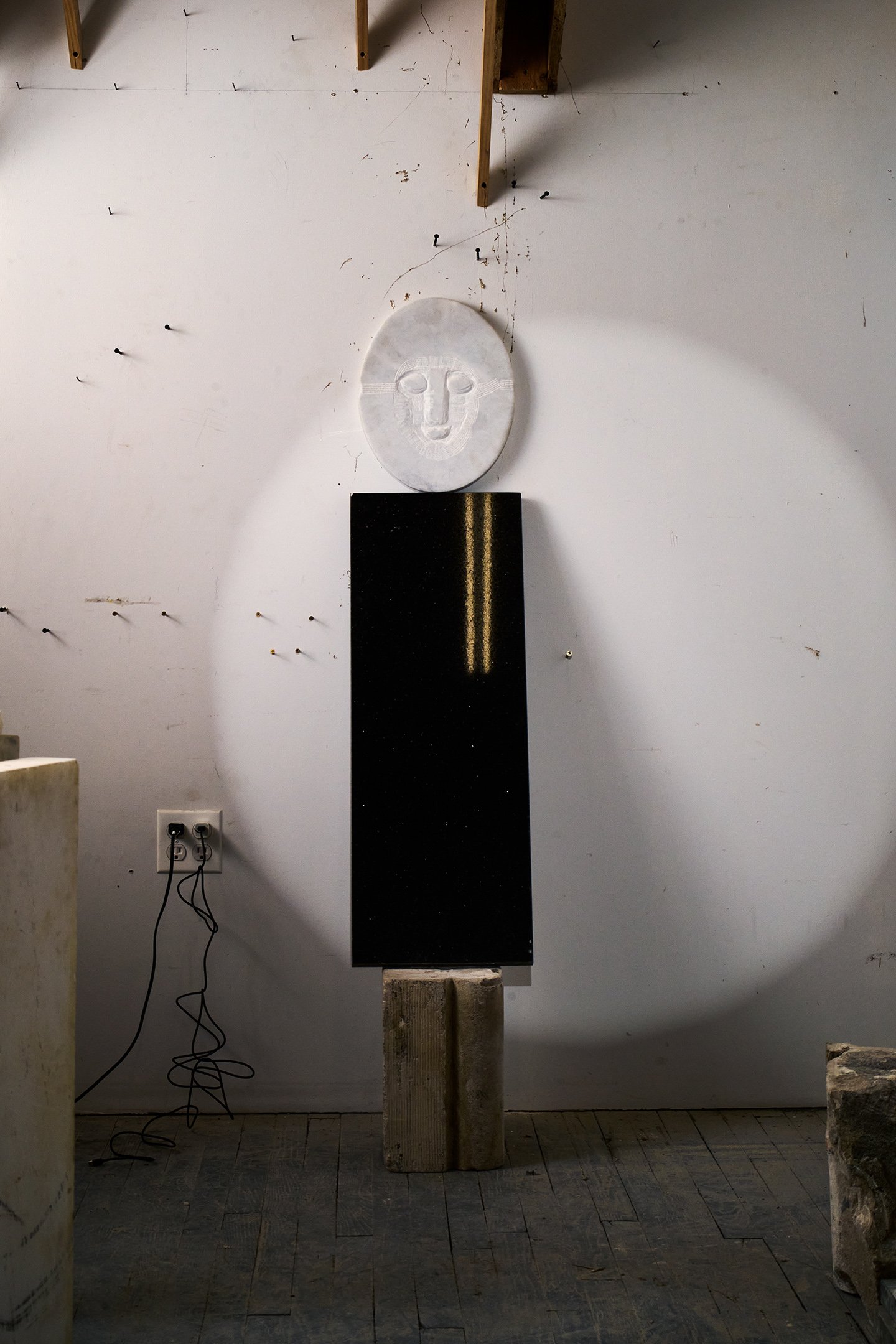  Photograph of:  Figure/s II , 2023, Marble, limestone, 12” X 15” X 58”  Photograph and lights by Hannah Whitaker for "Dim, Dahlia, Violet, Stone" (ITI Press, 2024) 