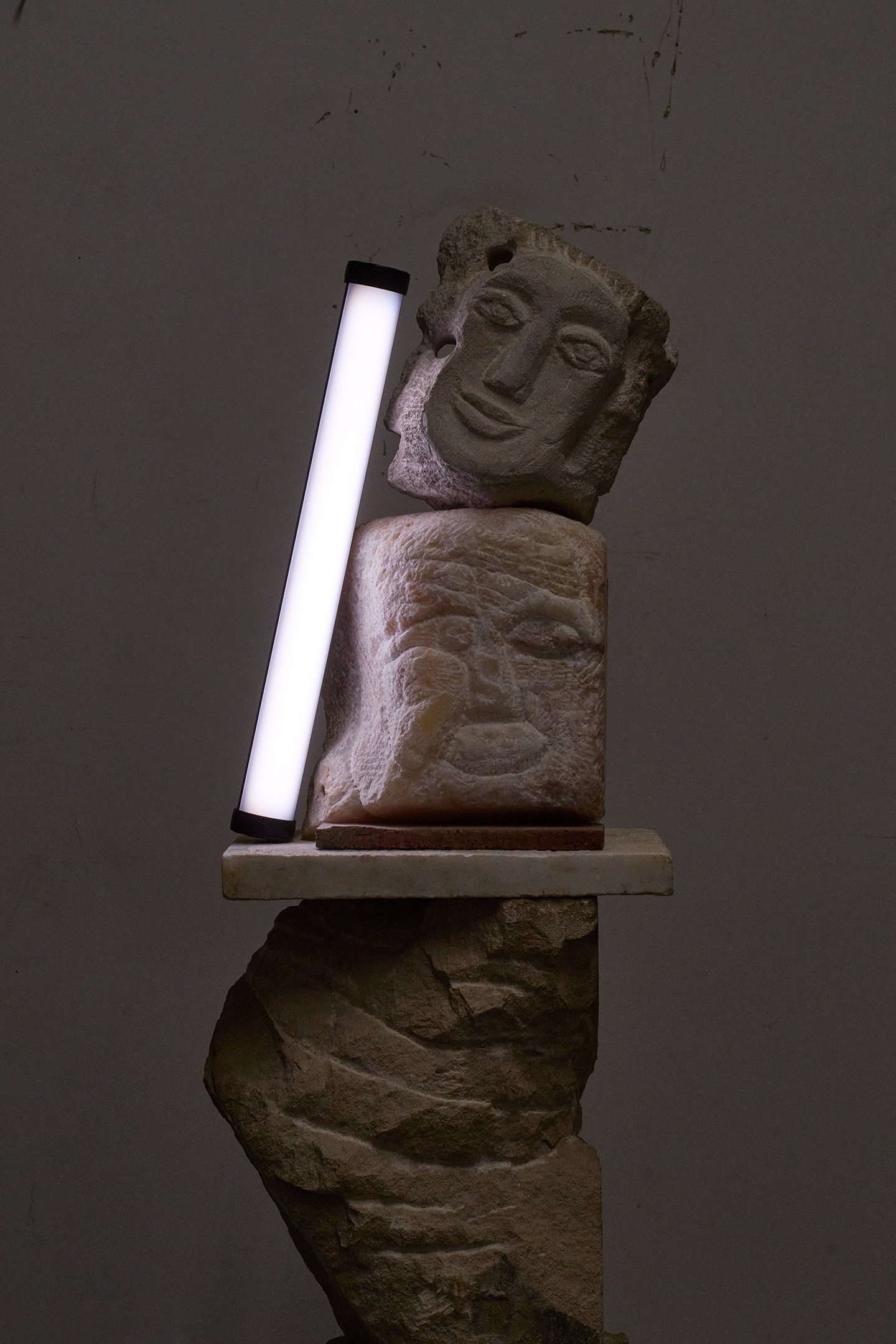  Photograph of:  Figure/s III , 2023, Alabaster, honeycomb calcite limestone, pipe stone, 48” X 12” X 12”  Photograph and lights by Hannah Whitaker for "Dim, Dahlia, Violet, Stone" (ITI Press, 2024) 