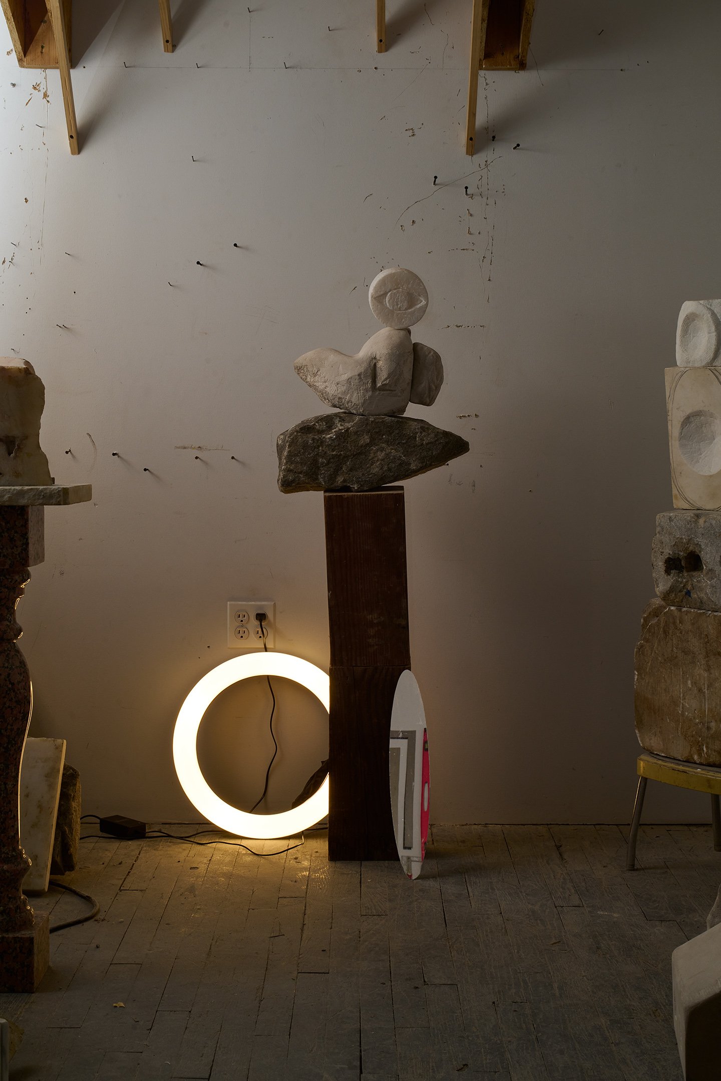  Photograph of: Eye/Bird, 2023, Alabaster, granite, wood, 55” X 14” X 8”, 2023  Photograph (with lights and mirror) by Hannah Whitaker for "Dim, Dahlia, Violet, Stone" (ITI Press, 2024) 