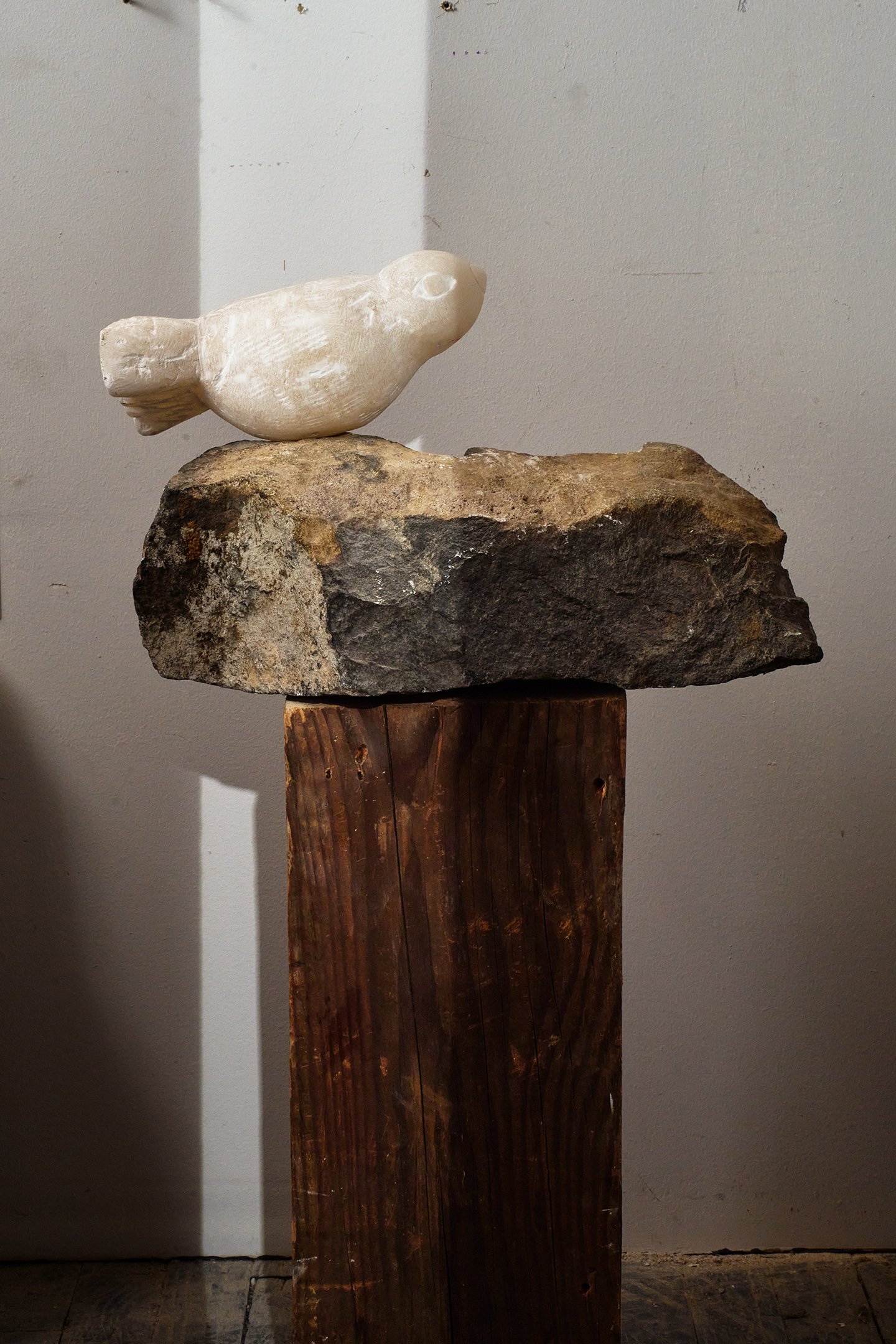  Photograph of:  Bird II , 2023, Alabaster, granite, wood, 30” X 16” X 8”  Photograph by Hannah Whitaker for "Dim, Dahlia, Violet, Stone" (ITI Press, 2024) 