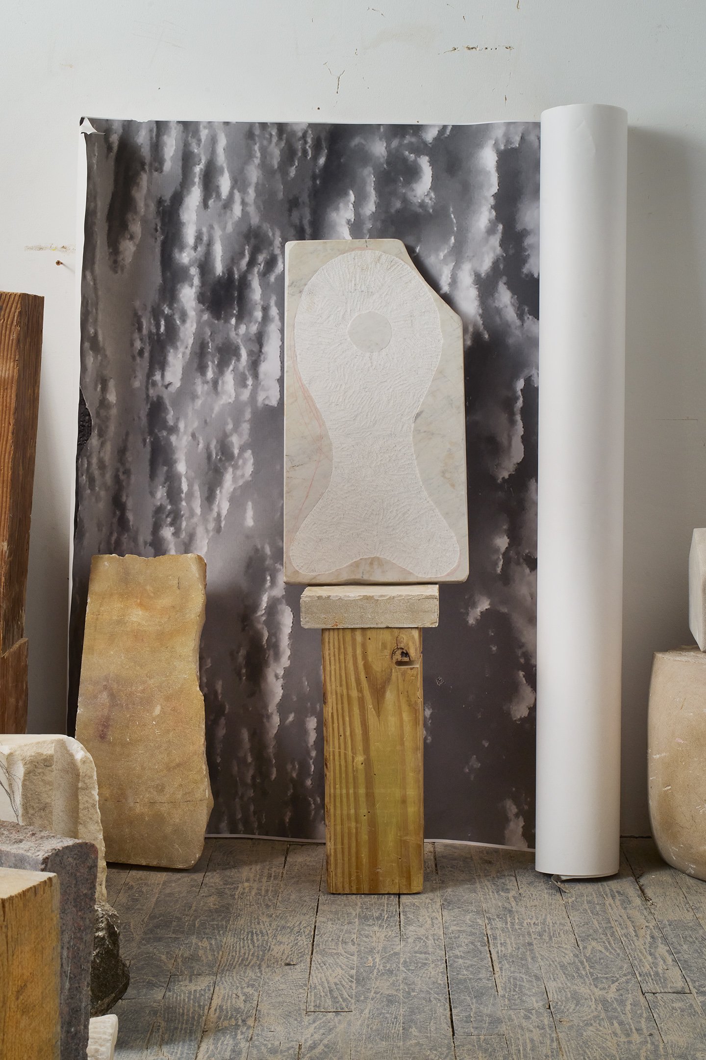  Photograph of:  Fish , 2023, Marble, wood, 55” X 14” X 8”    Photograph (with lights) by Hannah Whitaker for "Dim, Dahlia, Violet, Stone" (ITI Press, 2024) 