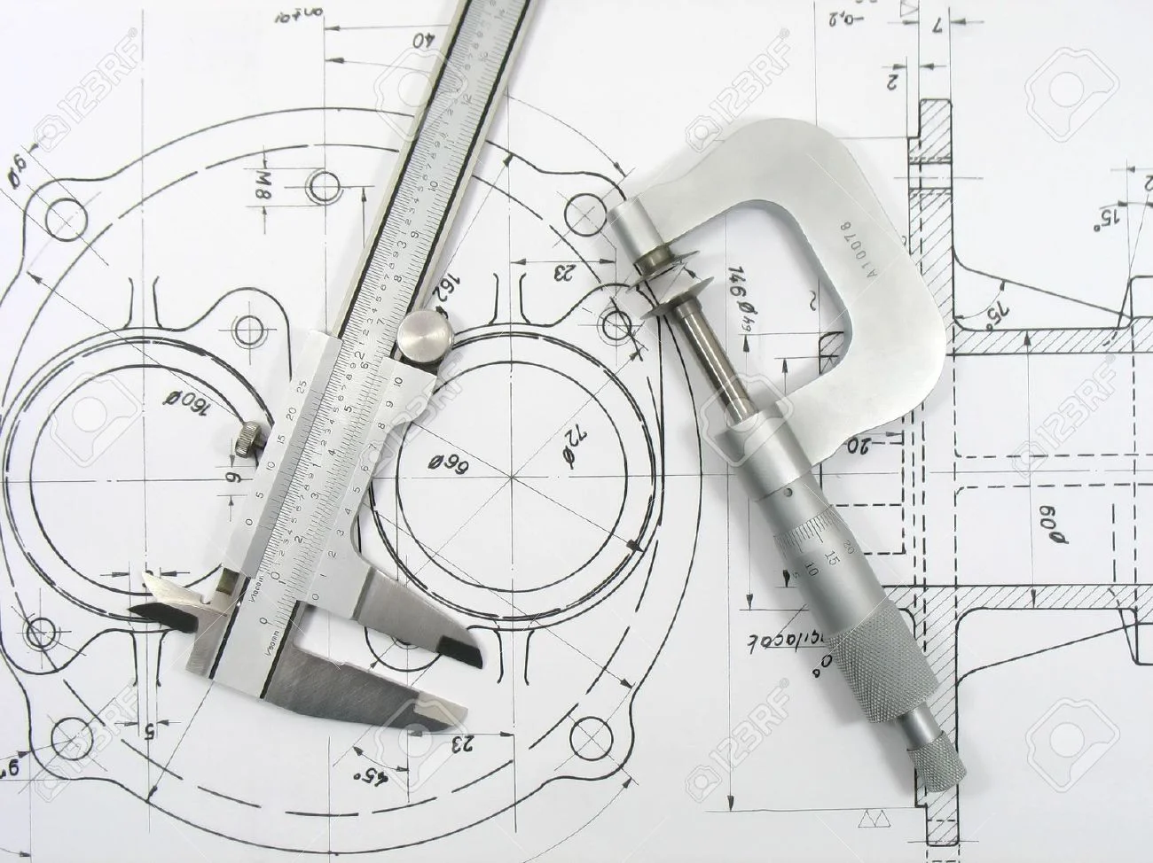 3104434-Engineering-tools-on-technical-drawing-Stock-Photo-mechanical-caliper-drawing.jpg