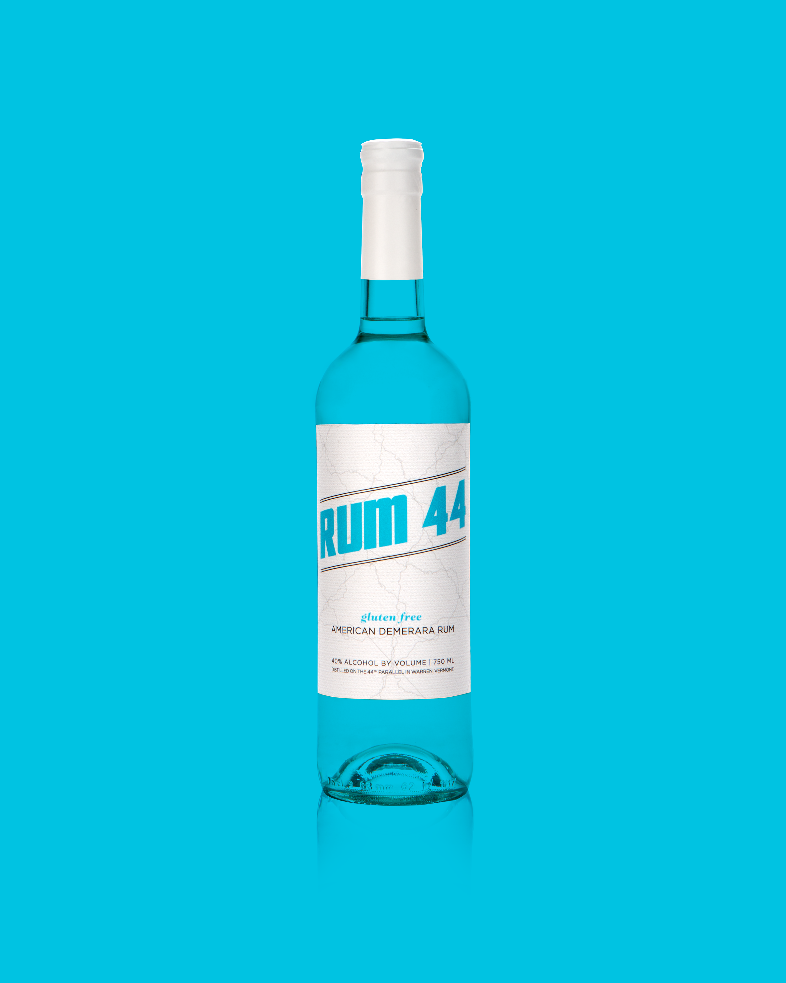Rum-44-White-Capsule-Reflection-Blue-BG.jpg