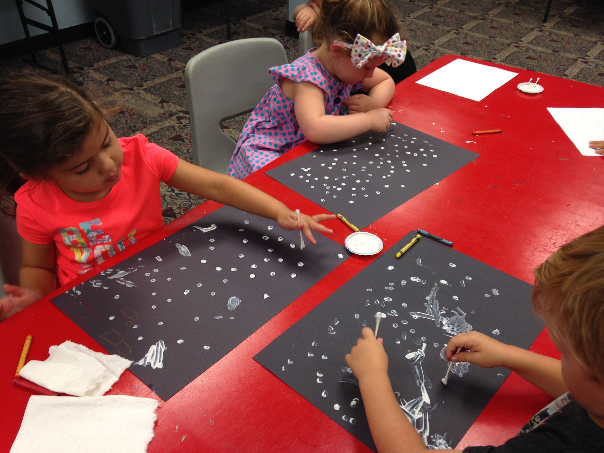 Each camper used their own techniques on this project, from different hand holds on the cotton swabs used to paint to an ambidextrous approach!