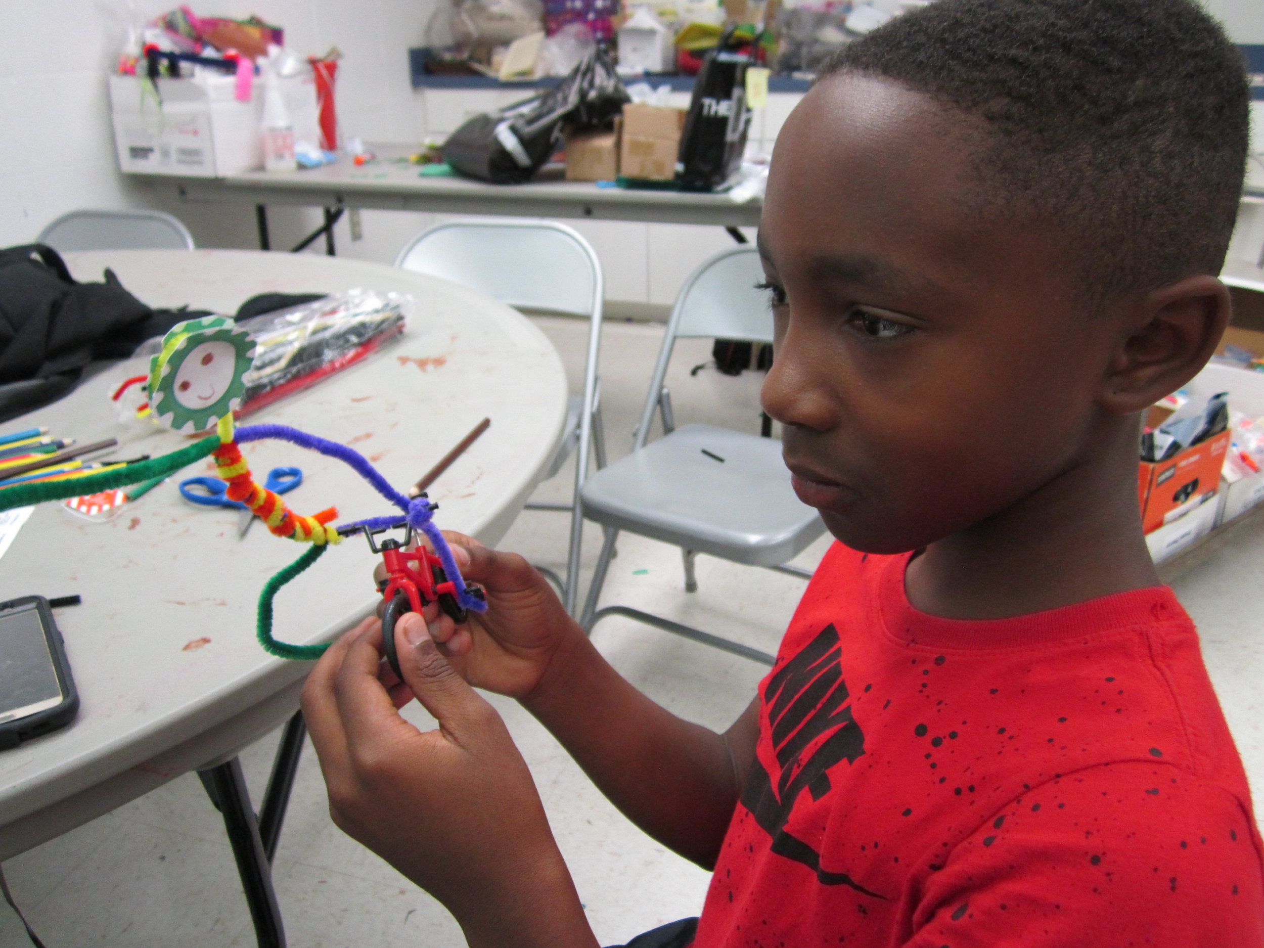 This student from Frank Pierce Rec. Center crafts his rider.