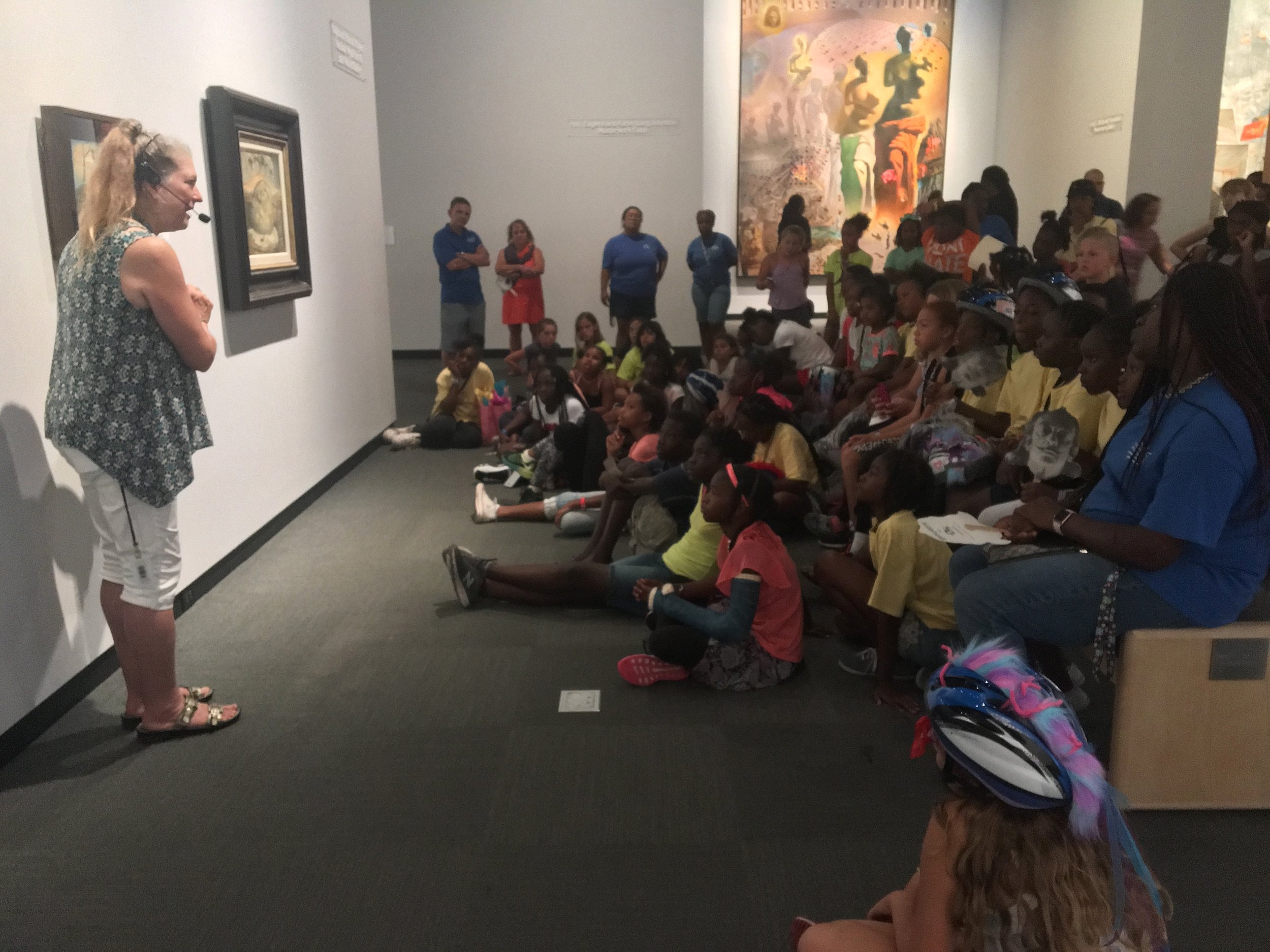 Following all the excitement of the Bicycle Rodeo, everyone had a chance to cool off in the Dalí Museum Galleries as Vickie Brunner, Family Programs Coordinator and Docent connected works by Dalí to our summer content.