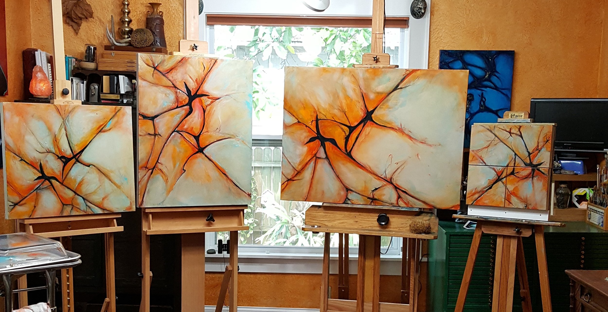 Crazy six midway - 20 layers in pieces, now each spiraling clockwise daily as paint is applied. Pieces are no longer synchronized during painting. Small piece at the right is actually 3 canvases also spiraling clockwise and no longer synced.
