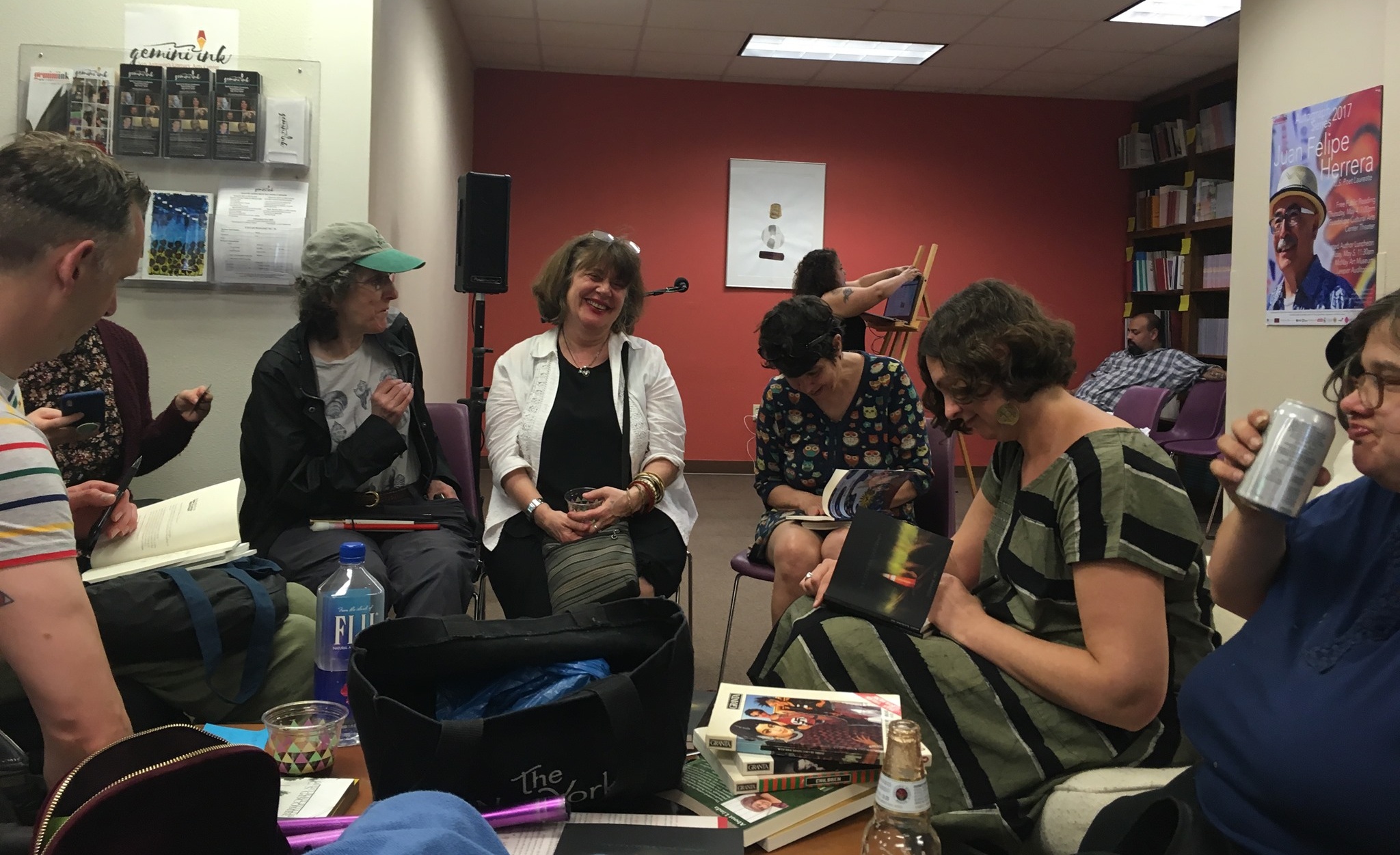                      2019 Conference participants talk and laugh while working in a small group at Gemini Ink in San Antonio, TX. 