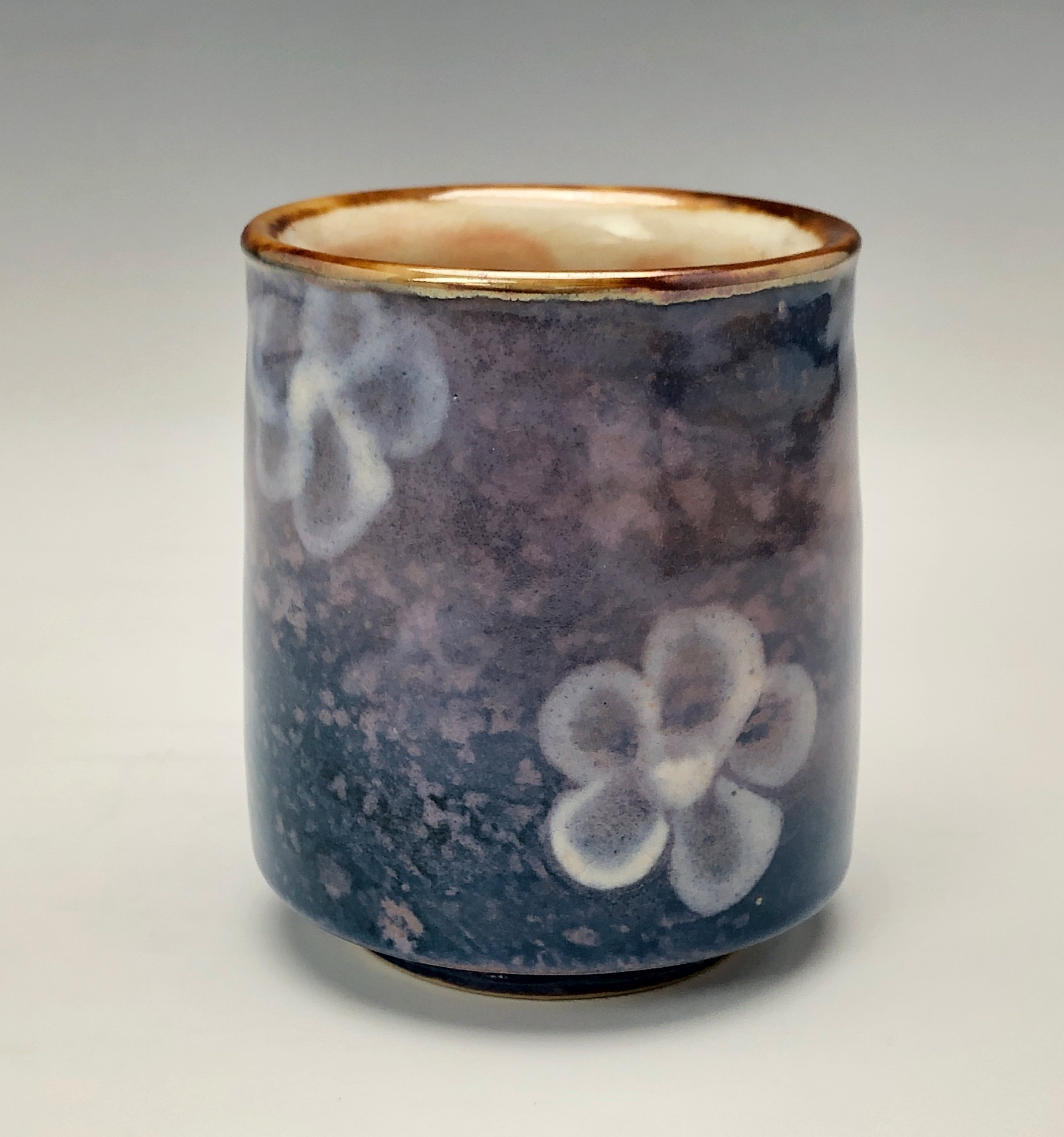  Bruce Gholson, Bulldog Pottery, Seagrove, North Carolina  Yunomi 4- Casual drinking cup made from porcelain. This cup is glazed with a lavender blue shino with a drawn fish in red over glaze. 