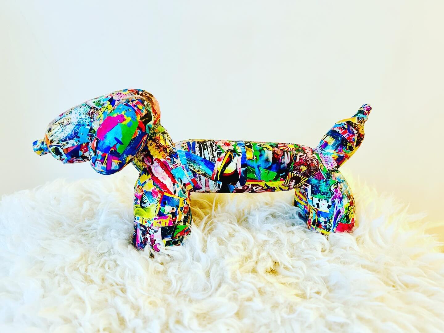 The Wiener Balloon Dog 

in memory of my childhood furbaby, lily, this sculpture is a whimsical exploration of form and character. the sculpture captures the essence of a dachshund with its characteristic elongated body, rendered with smooth curves a