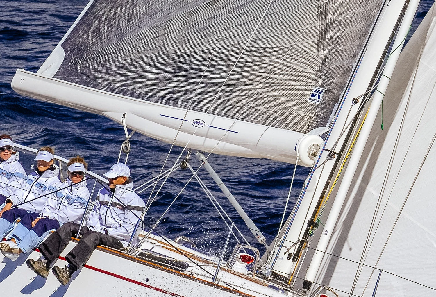 A close-up of a boom-furling mainsail. 