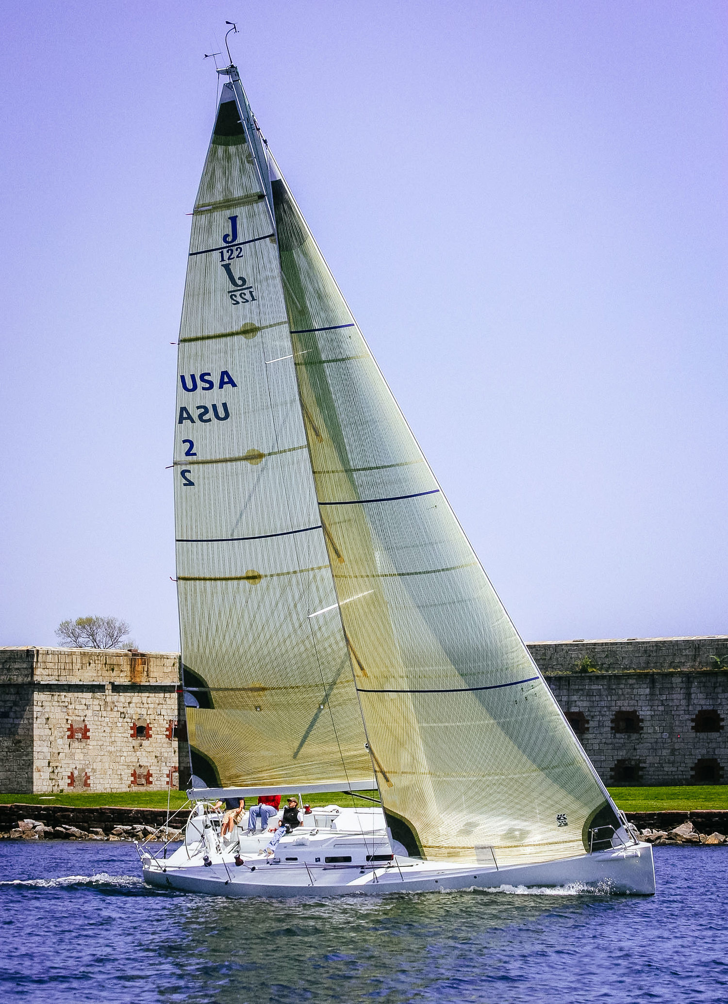 With wide swept-back spreaders, the jibs can overlap the mast slightly as shown above on this J/122.