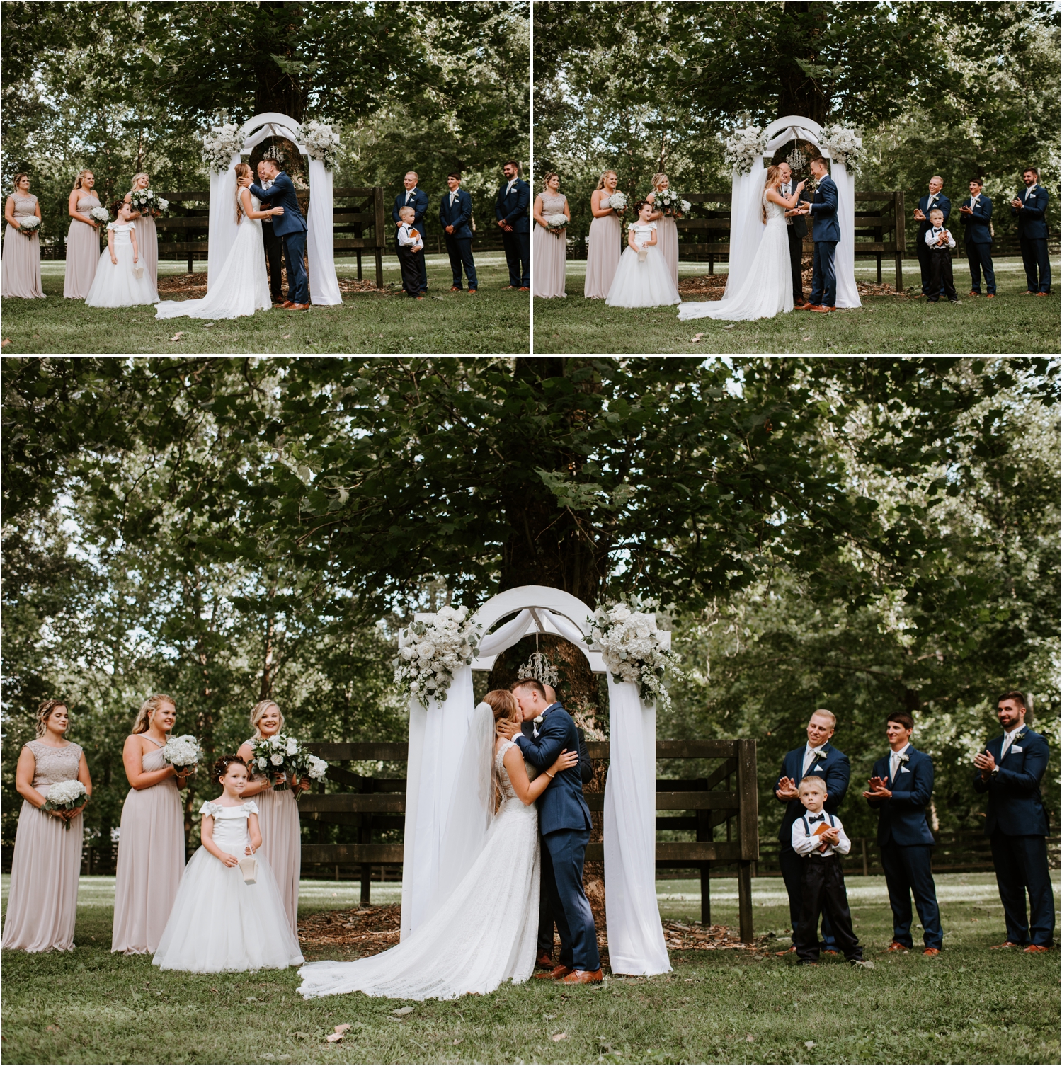 bride and groom first kiss under white arbor with floral arrangements and drapes