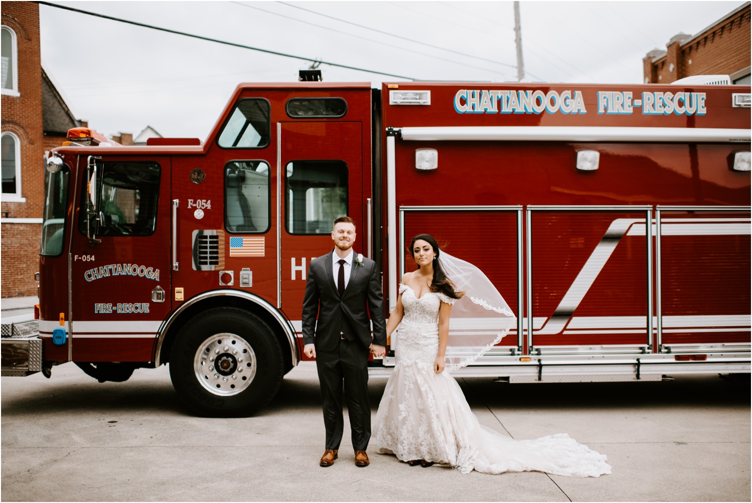 bride and groom portrait in front of fire truck