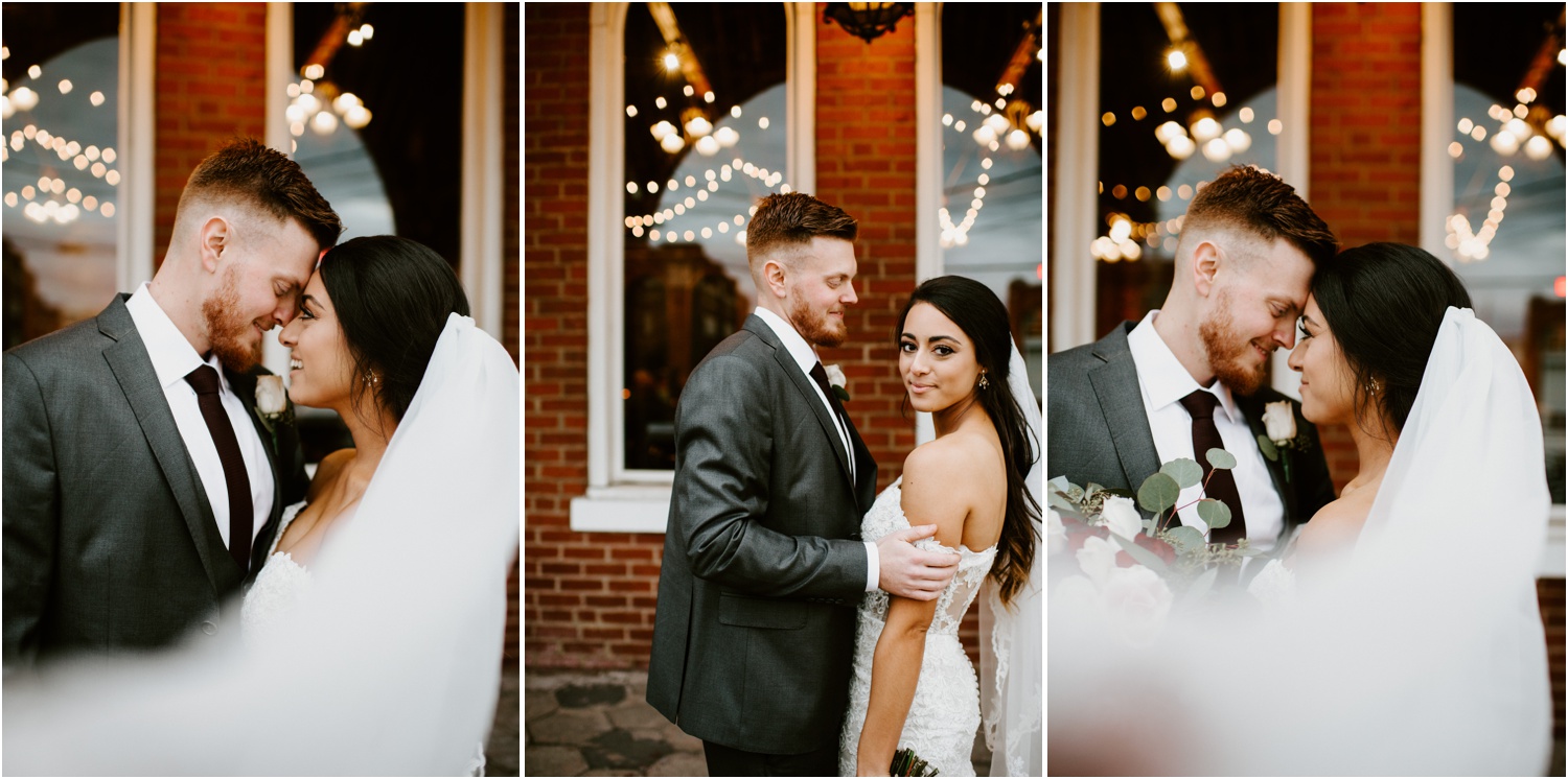 veil blowing in the wind bride and groom portrait