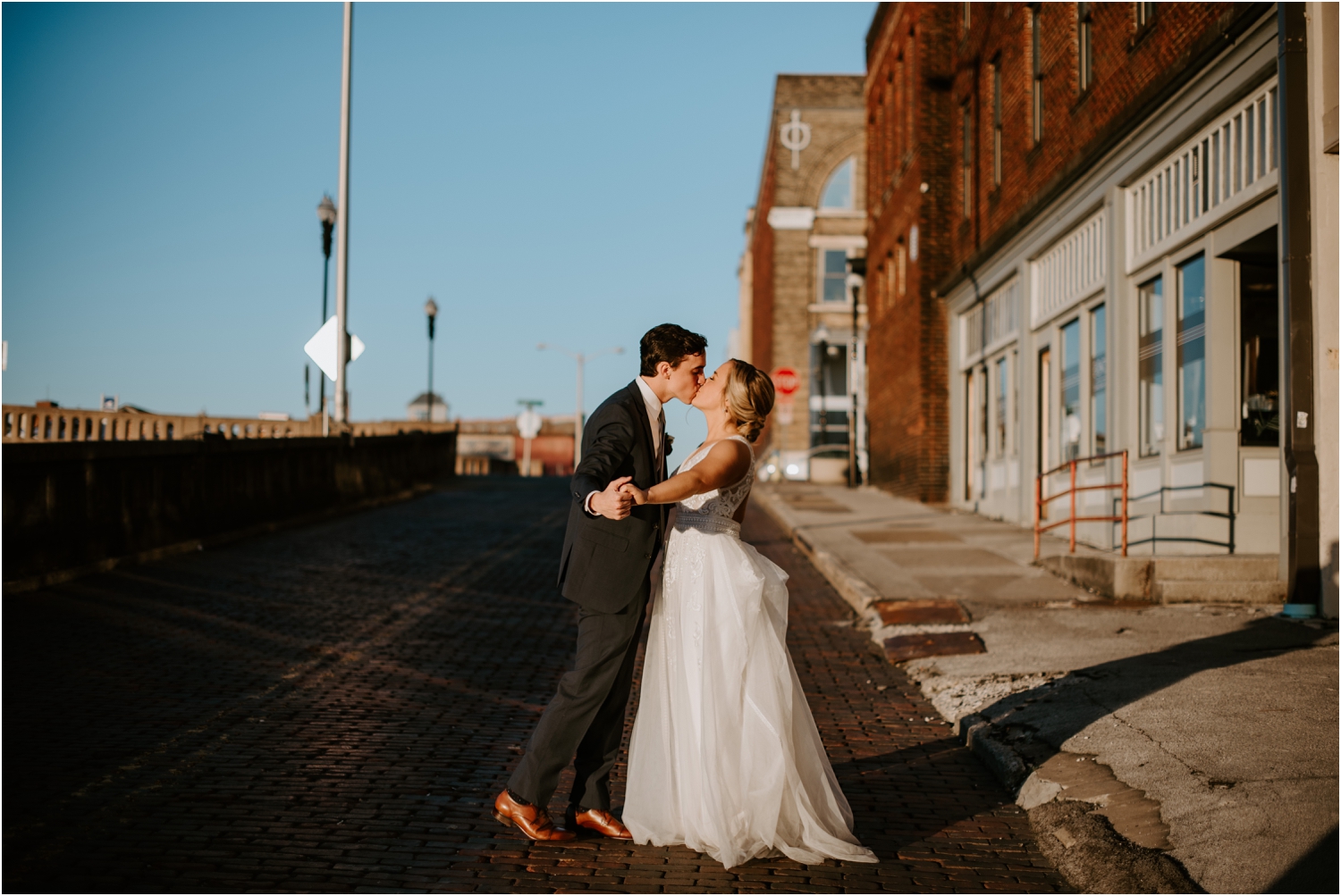 golden hour sunset bride and groom picture cobblestone road