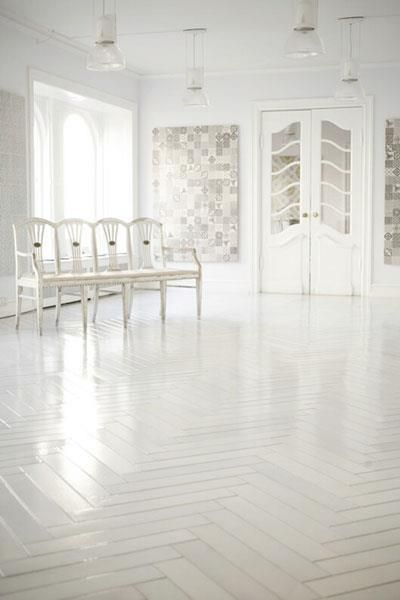 Fans of minimalist, try painting your parquet white for that ultra modern look.