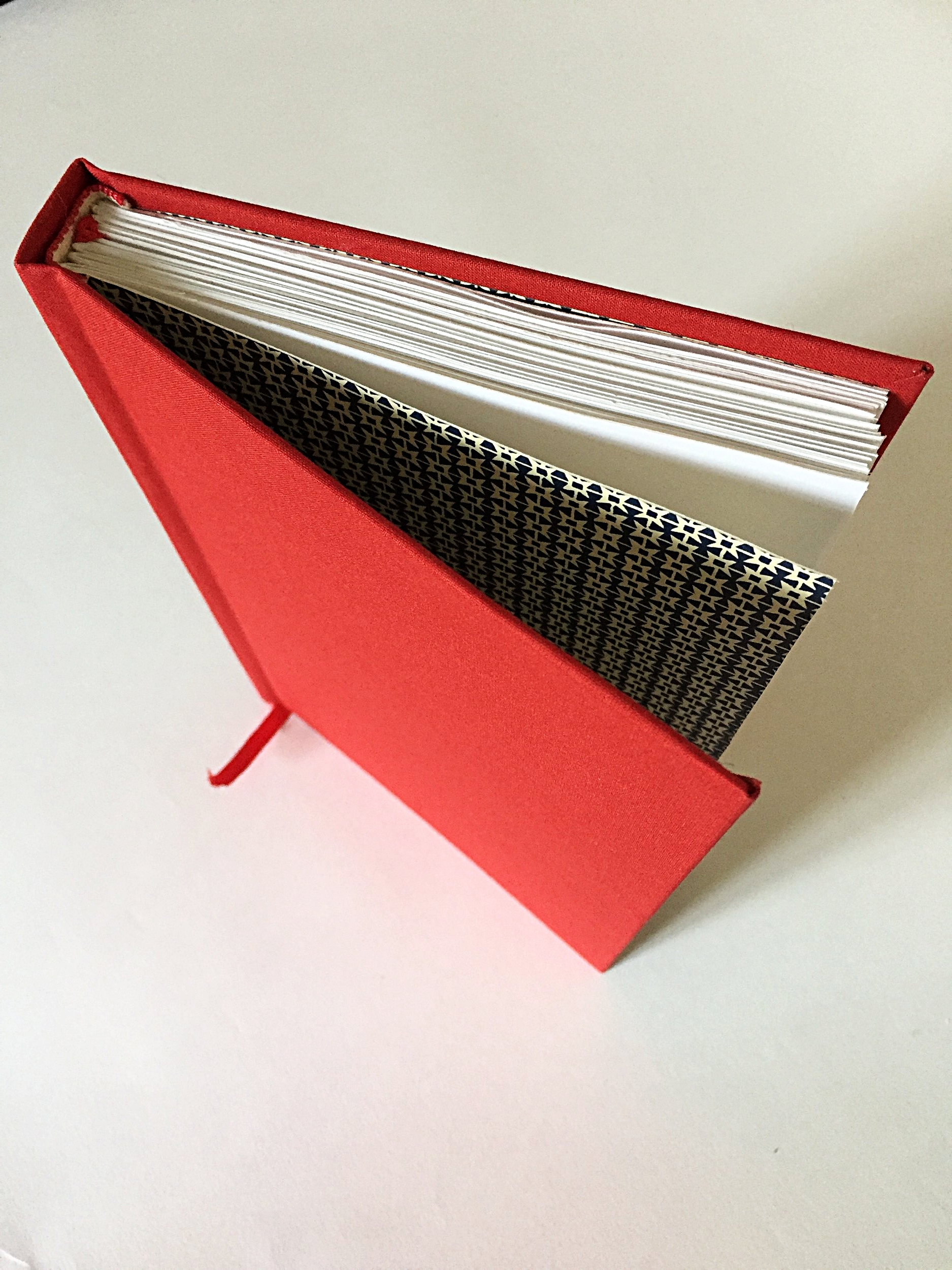 Hard-backed Multi-section book squared spine