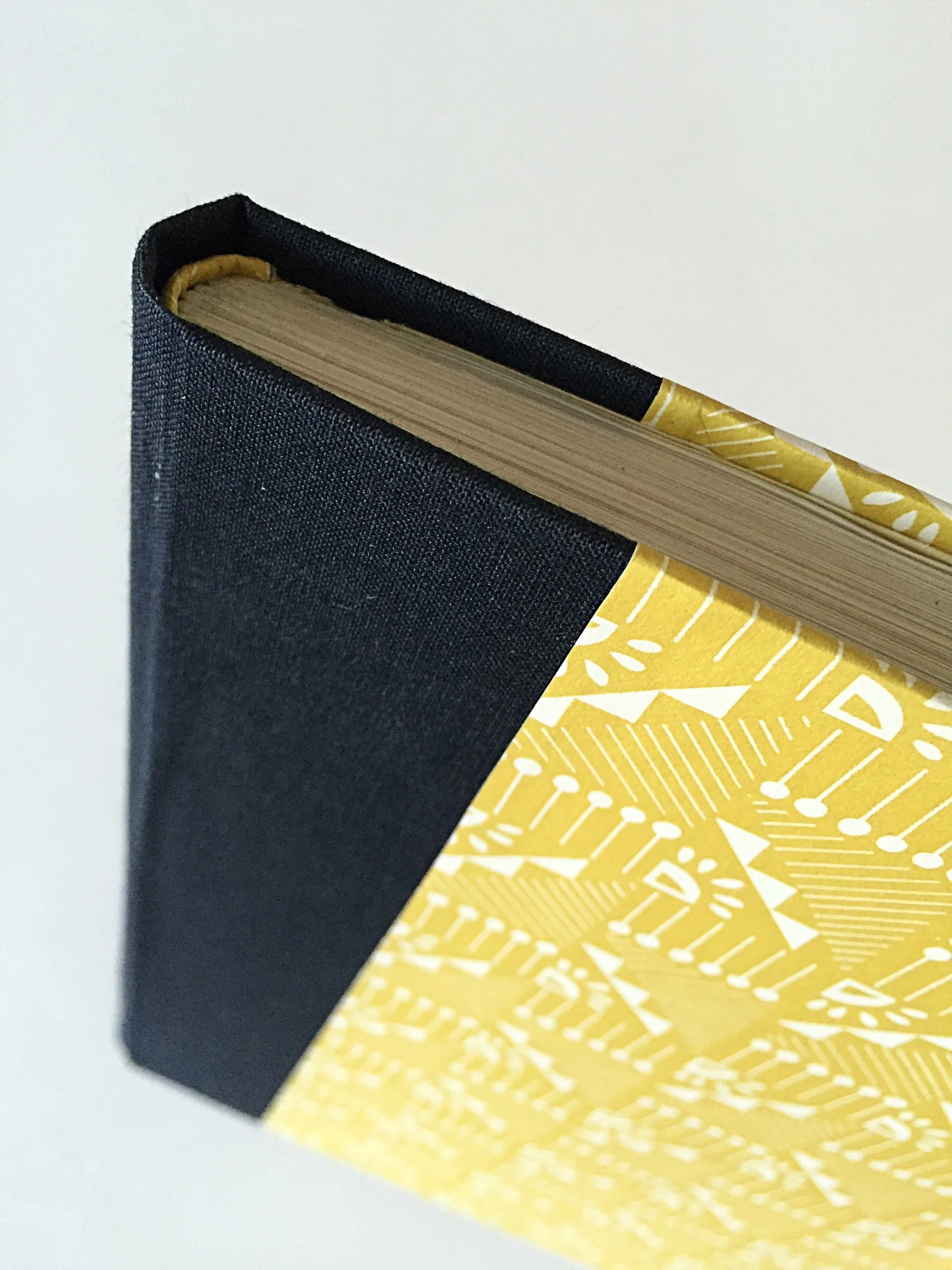 Hard-backed Multi-section Binding with rounded spine