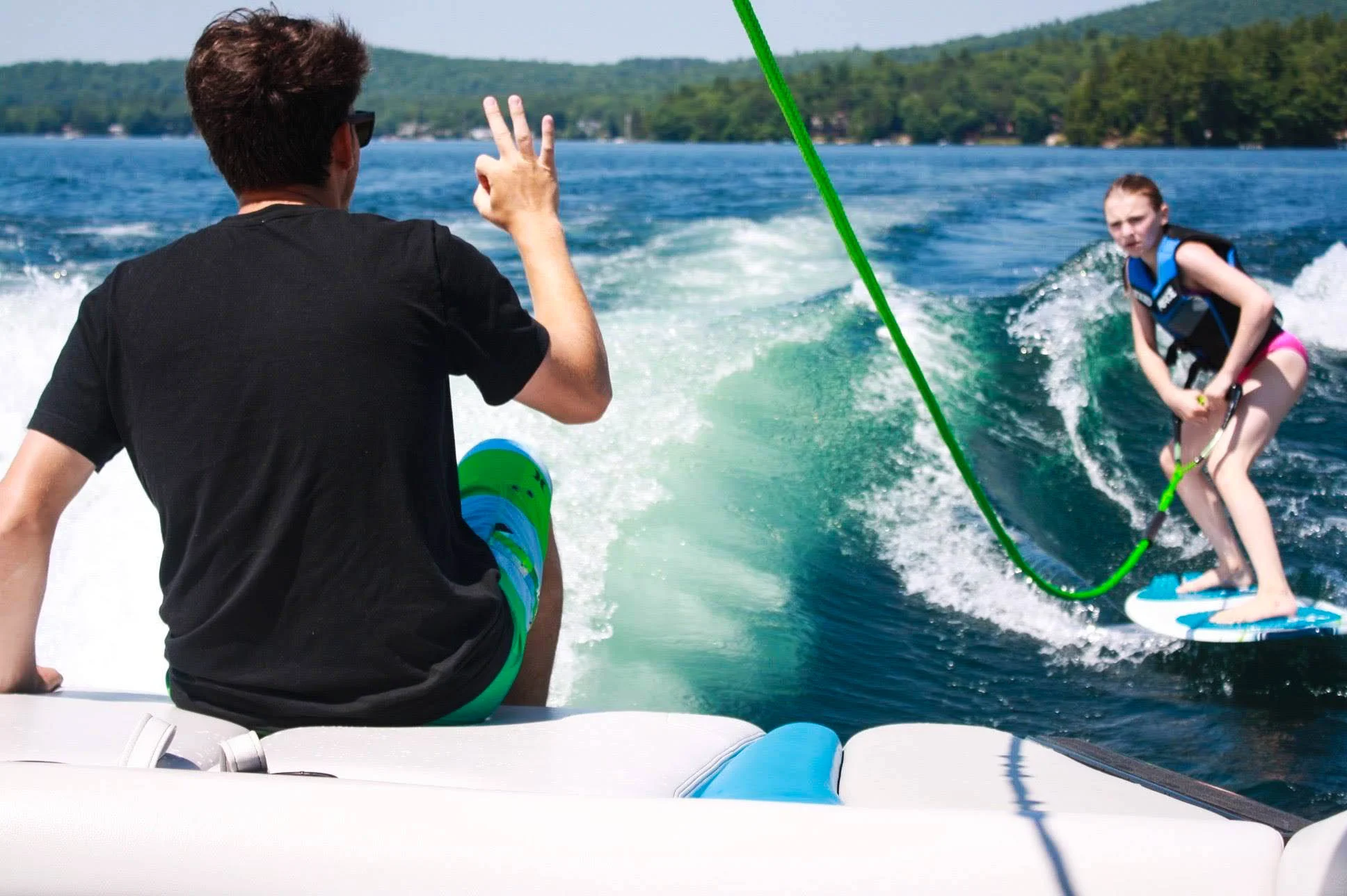 Summer camp lake instructor wakesurf