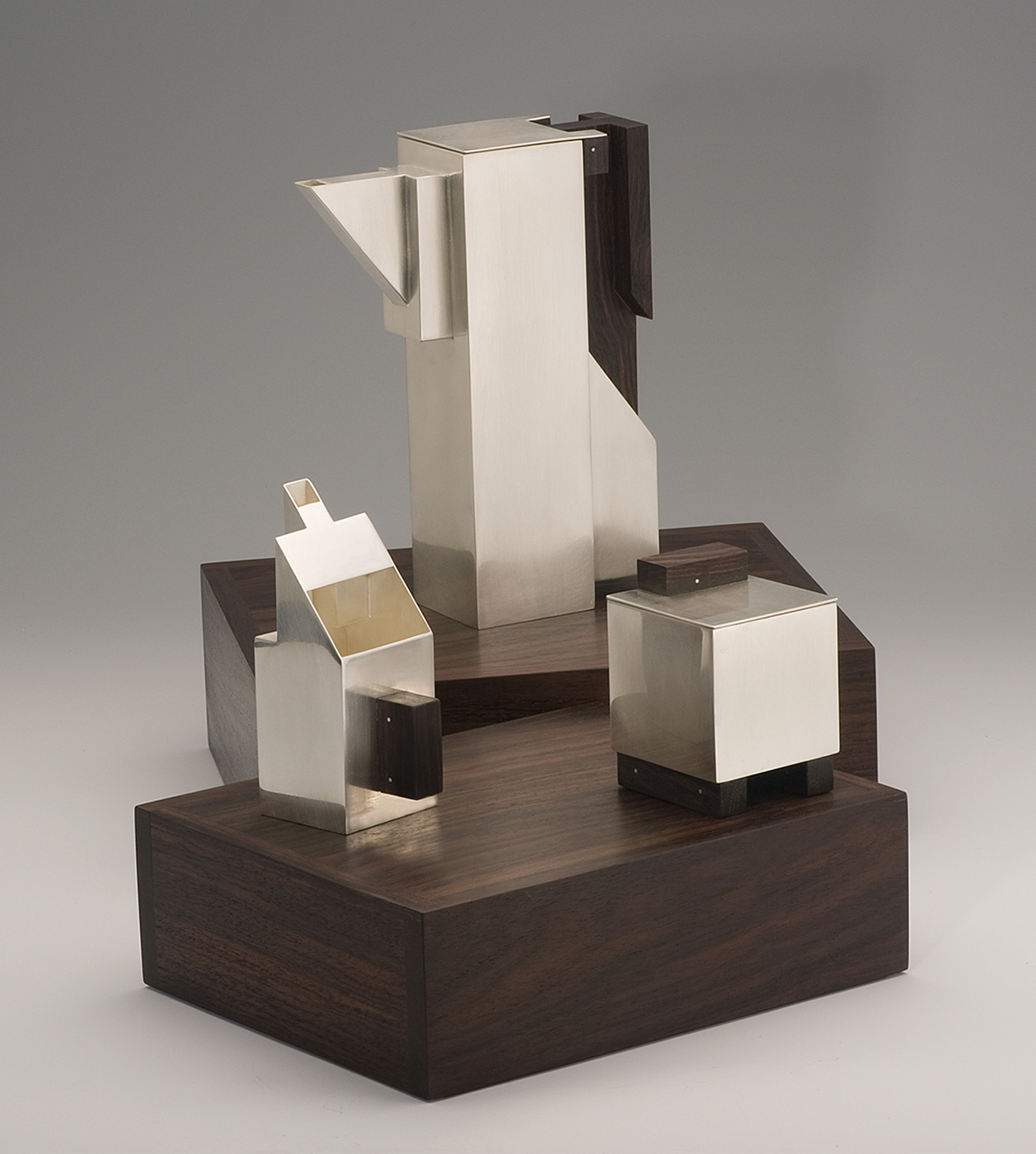 Puzzle Teaset-open  |  2010  |  sterling silver, rosewood  |  10.25 x 8.5 x 3.33 inches