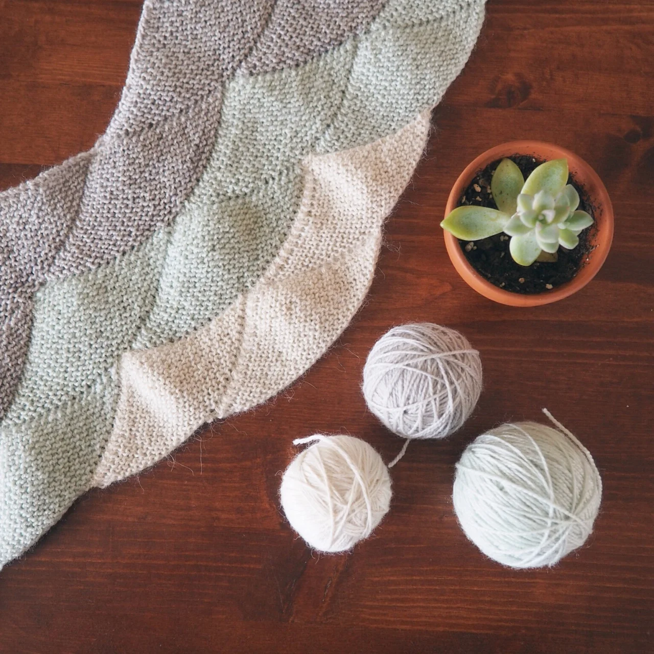 How many wip’s does the average knitter have going at the same time? At the moment I have two (not counting the swatch I’m doing for a third!), which I think is pretty restrained! I used to be a very monogamous knitter and would only work on one thing at a time but the last few years I’ve found myself jumping around more and more. The above shawl is the Aranami Shawl by Olga Buraya-Kefelian and I’ve been working on it for a while now. Not because I’m not enjoying knitting though, it’s one of my favourite things I’ve ever knit! I’ve just changed my mind so many times on the colours I’ve spent a lot of time unraveling. I am currently waiting for some yarn to arrive (alpaca!) so I can finally finish the last tier! Hopefully I’ll have some finished photos up here before long!