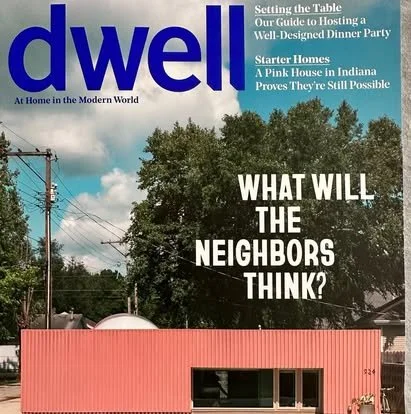 Magazine cover featuring the title "dwell" and the headline "What will the neighbors think?" with a house and trees in the background.