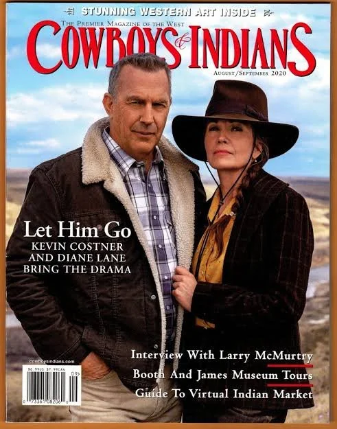 Magazine cover of Cowboy & Indians, August/September 2020, featuring a man and woman standing outdoors. The man is wearing a brown jacket with a shearling collar and a plaid shirt. The woman is dressed in a dark hat, plaid shirt, and dark jacket, wit