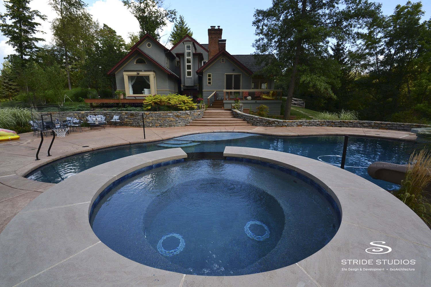 32-stride-studios-spa-pool-fieldstone-patio.jpg
