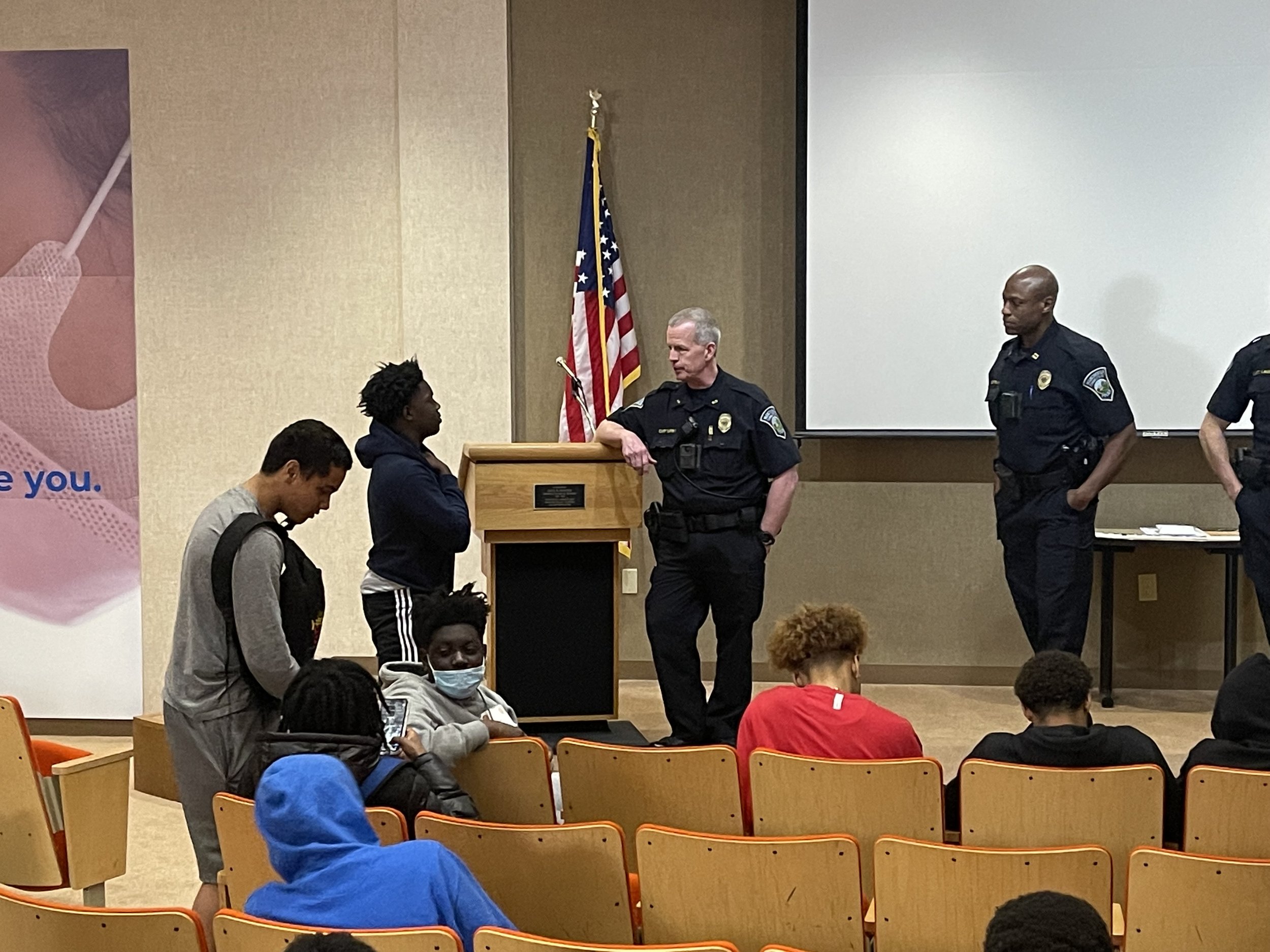 Police officers educating young men