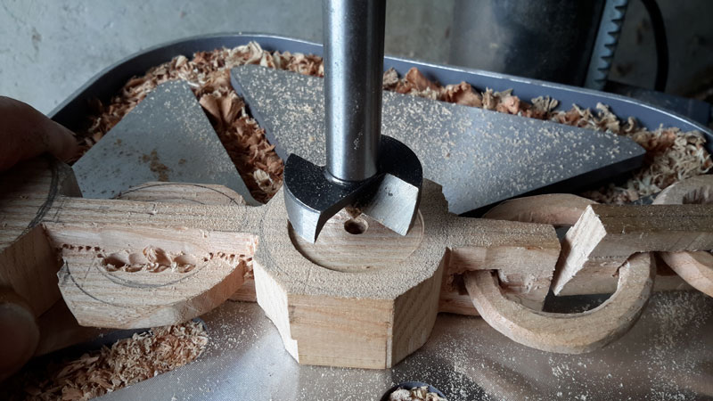 Drilling the larger recess in the medallion block.