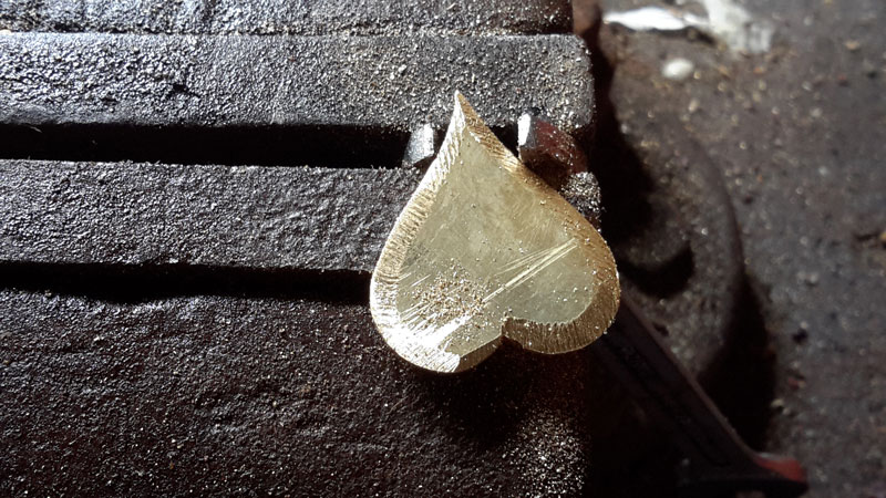 Shaping the brass heart insert.